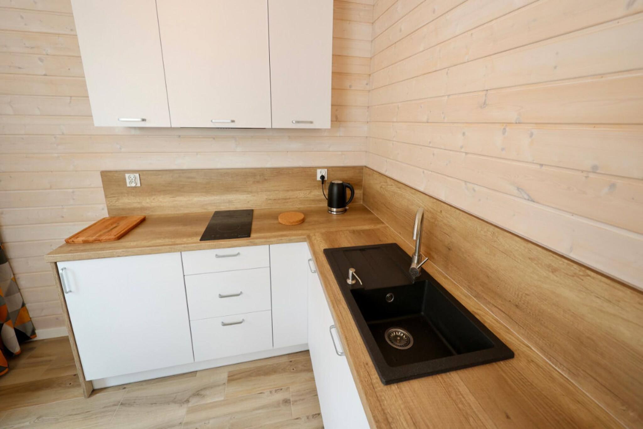 Ground floor: (Entrance, open kitchen(dining table, electric kettle, boiling water tap, toaster, cooker(2 ring stoves, electric), espresso machine, dishwasher, fridge), Living/bed room(double sofa bed, TV(german television channels), seating area), bathroom(shower, washbasin, toilet))\n\nOn the 1st floor: (bedroom(double bed or 2 single beds), bedroom(single bed, single bed))\n\nParking, terrace, garden(shared with other guests, fenced, landscaped garden), garden furniture, BBQ, trampoline, football goal, high chair