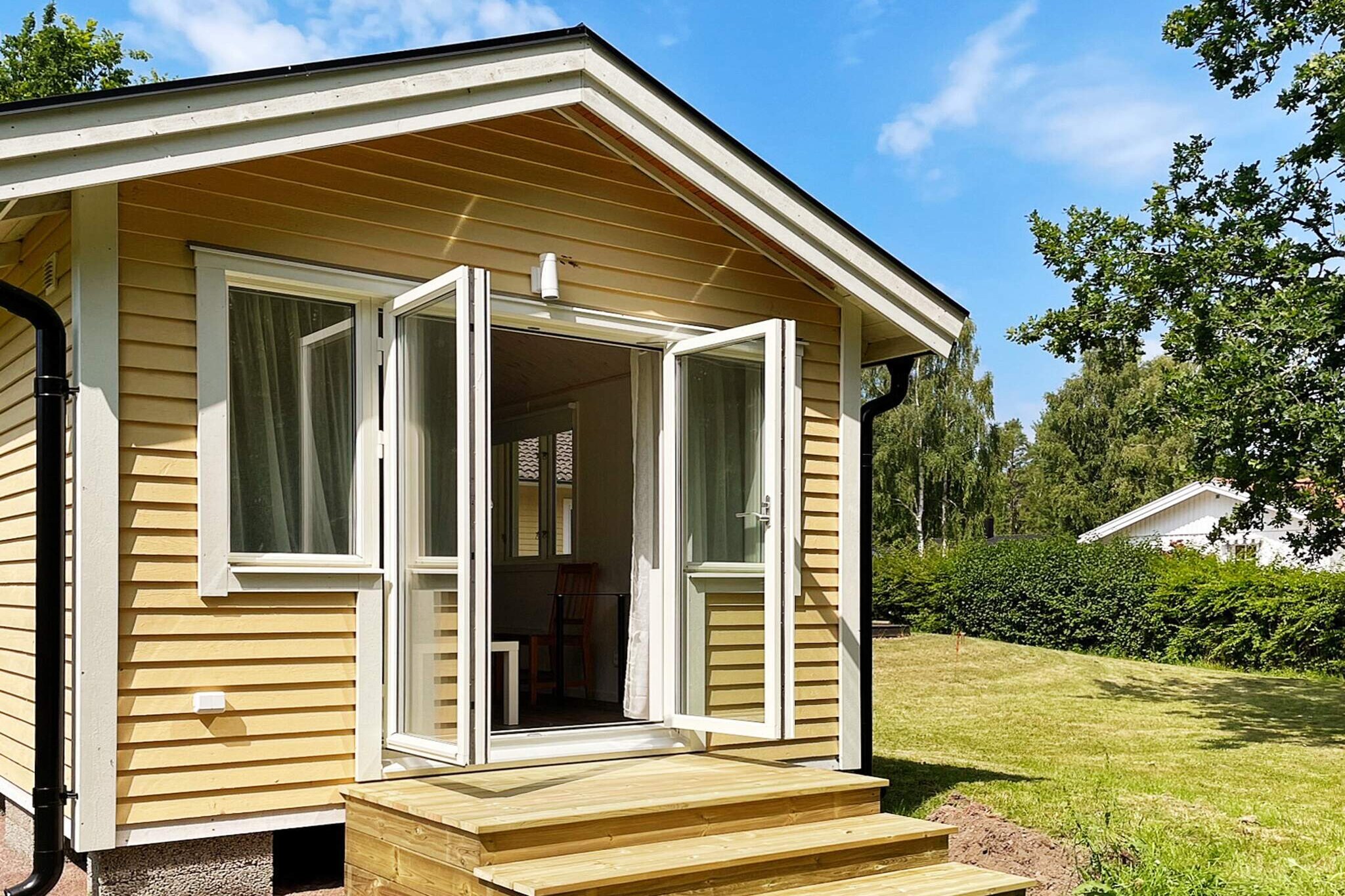 Annex: (single folding bed, double folding bed, washbasin, shower, toilet)\n\nKitchen(cooker(electric), microwave, fridge-freezer), Living/bed room, bedroom(double bed), bedroom(2x bunk bed), bathroom(washbasin, shower, toilet), bathroom(washbasin, shower, toilet(reachable from the outside)), washing machine, balcony, heating(electric), garden, garden furniture, parking, deckchairs