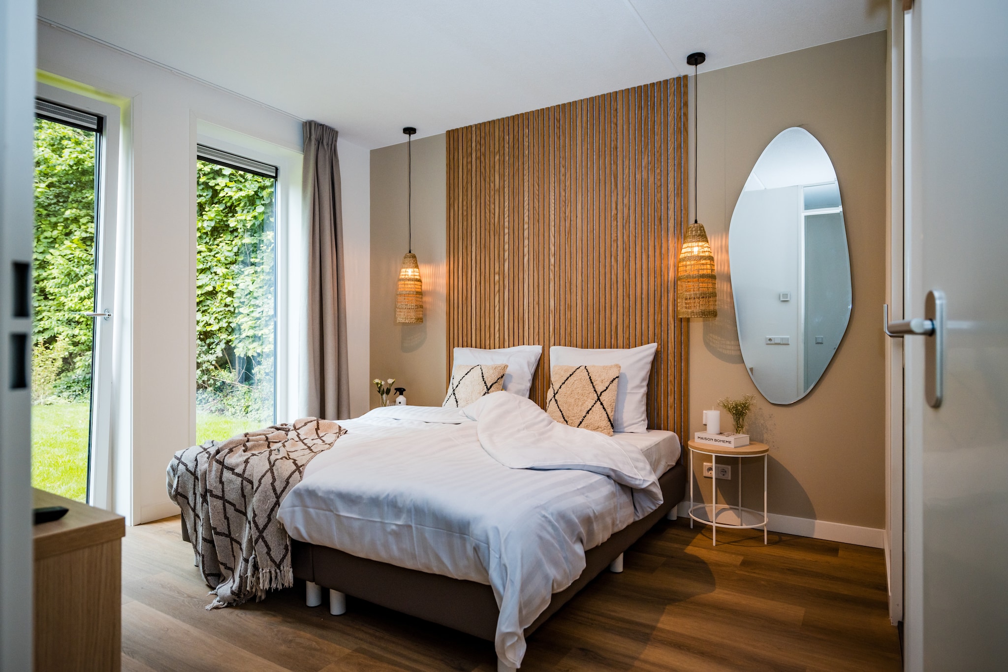 Ground floor: (Living room(TV, dining table(8 persons), seating area), Kitchen(hob, electric kettle, coffee machine, oven, microwave, dishwasher, fridge, freezer, dishes and cutlery, Cooking basics), bedroom(double bed), bedroom(bunk bed), bedroom(bunk bed), Bedroom with bathroom(double bed or 2 single beds, shower, washbasin, toilet), bathroom(shower, washbasin), toilet)\n\nsauna(shared with other guests), terrace, garden, garden furniture, parking, swimming pool(shared with other guests), playpen