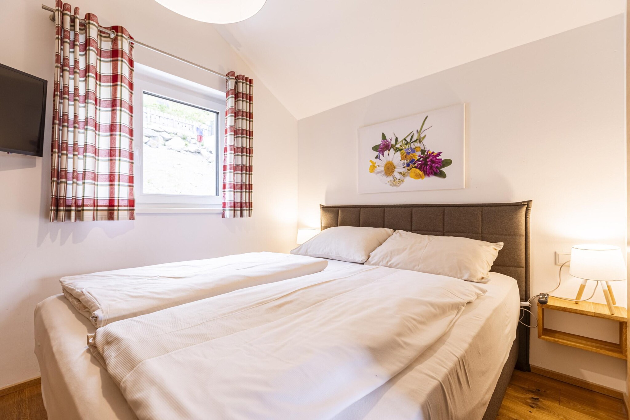 Experience the ultimate alpine getaway in our Superior Holiday Chalet, perfectly designed to accommodate up to 8 guests with style and comfort. Spanning 85 mÂ², this charming chalet offers ample space and a host of modern amenities for a memorable vacation. 

Nestled in a serene pine forest at around 1,800 metres above sea level, this chalet is perfectly positioned for both winter and summer adventures. In winter, you can explore nearby ski slopes and trails, while the summer months offer excellent opportunities for hiking, mountain biking, and enjoying the natural beauty of the Alps. 

The chalet features four elegantly furnished bedrooms, each with a double bed, ensuring restful nights for everyone. There are four bathrooms with shower. The spacious living area extends seamlessly to a balcony, where you can soak in the stunning mountain views and fresh alpine air. The open-plan kitchen is a culinary haven, fully equipped with everything you need. It includes cutlery, cookware, a ceramic hob, oven, dishwasher, and a fridge with a freezer compartment. Additional amenities such as a toaster, kettle, and coffee machine make meal preparation a breeze. On arrival, youâ€™ll find a small starter set with dishwasher tabs, dishwashing liquid, a sponge, garbage bags, cleaning supplies, and a tea towel, ensuring a smooth start to your stay. Enjoy complimentary Wi-Fi and satellite TV for your entertainment needs.   

Your stay includes the exclusive Butler Card or Butler Programme, adding an extra layer of convenience and personalized service to your alpine retreat.