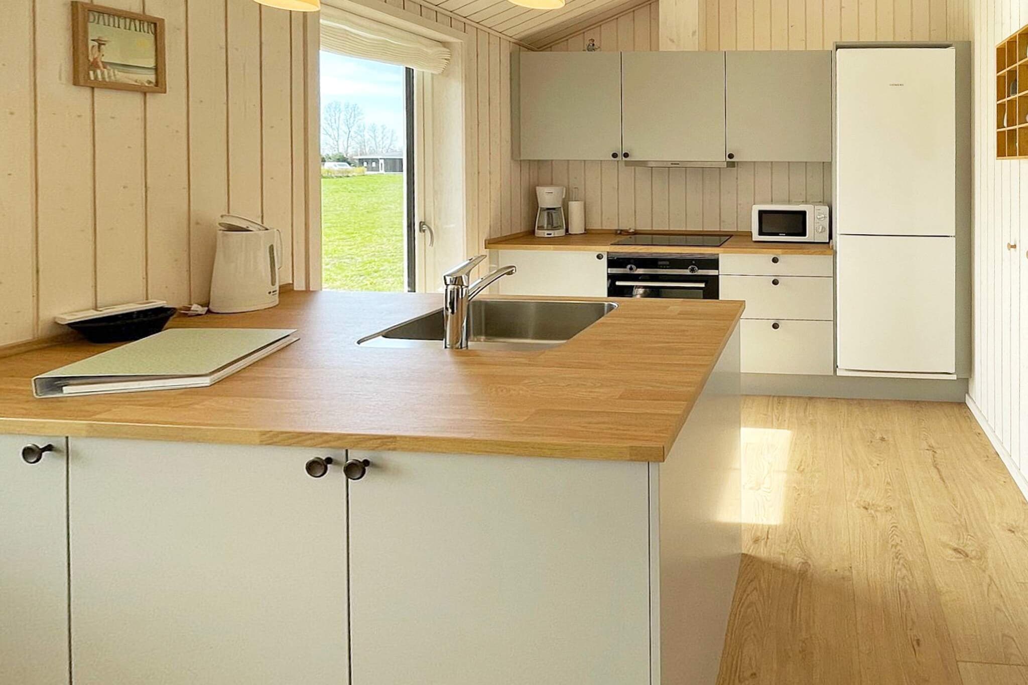 Kitchen(stove(induction), hood, coffee machine, microwave, dishwasher, fridge-freezer), Living/bed room(Internet access, TV, high chair, air to air heatpump, chromecast), bedroom(double bed, children\'s bed), bedroom(double bed), bedroom(2x single bed), bathroom(floor heating)(bathtub or shower, washbasin, toilet, washing machine), microwave, heating(electric), terrace, garden furniture, air to air heatpump