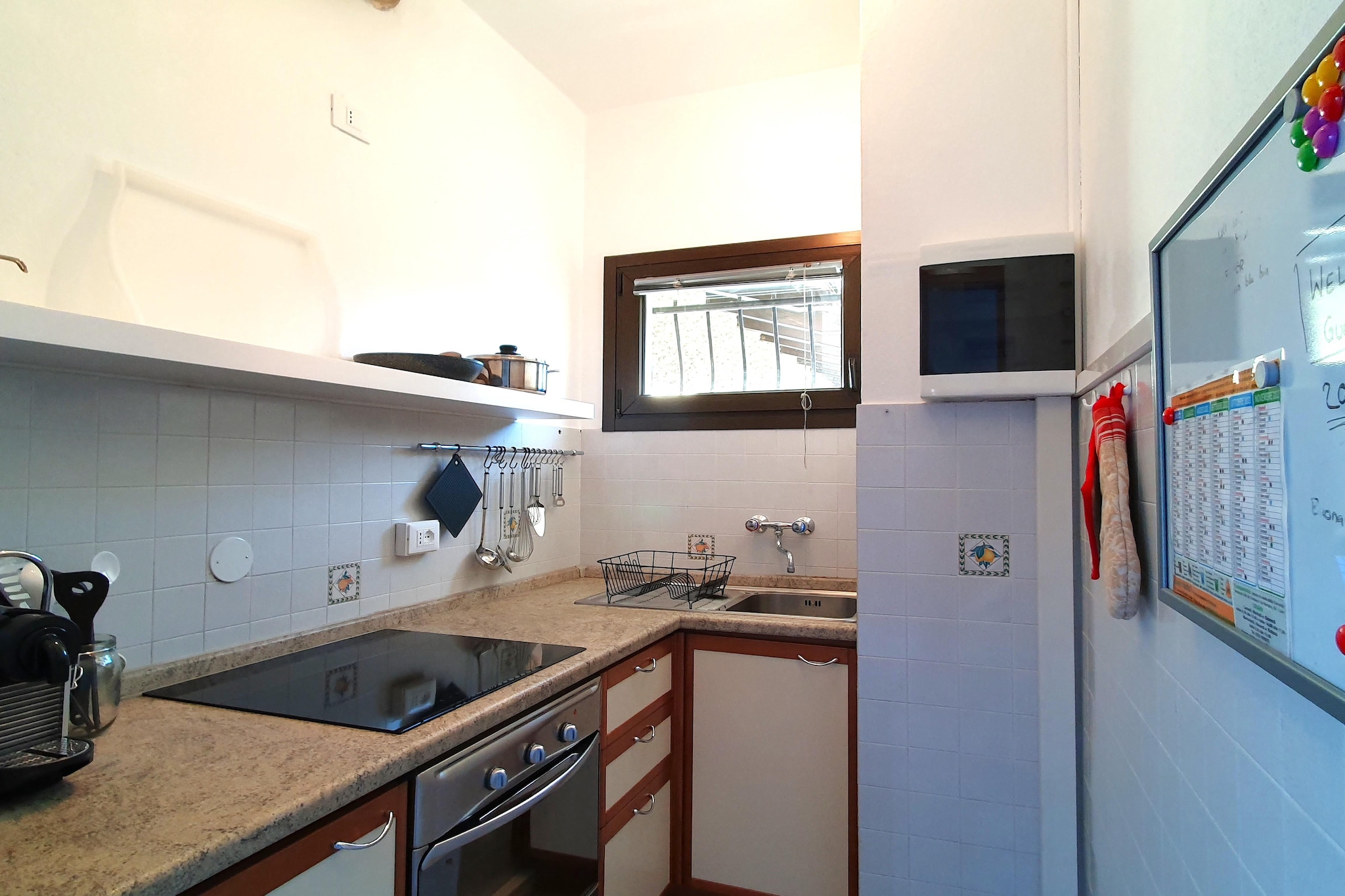 Ground floor: (Living room(TV(satellite), dining table, seating area, air conditioning), open kitchen(hob(electric), electric kettle, toaster, oven, fridge-freezer, washbasin), bedroom(double bed), bedroom(small double bed), bathroom(bathtub with shower, washbasin, toilet, hairdryer), terrace(private), BBQ, outdoor fireplace)\n\ngarden(private, fenced), garden furniture, sun loungers, parking