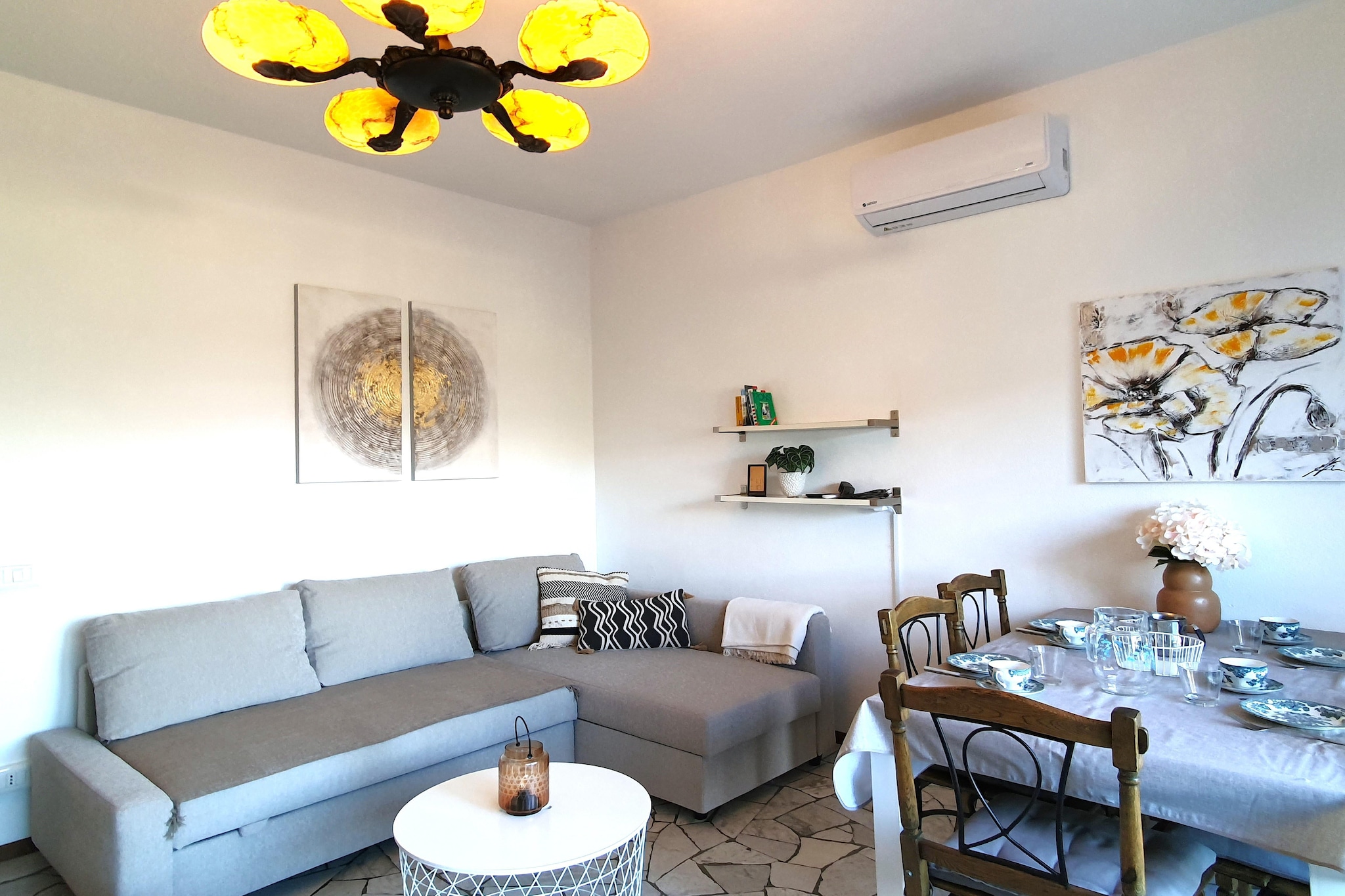 This inviting ground-floor holiday home in Germignaga is perfect for a relaxing getaway near Lake Maggiore. With two comfortable double bedrooms, a spacious living area featuring a satellite TV, dining space, and air conditioning, it's ideal for families or couples seeking a peaceful stay just 400 meters from the town center.

The property offers a well-equipped open kitchen with an electric hob, oven, kettle, toaster, and fridge-freezer. The bathroom includes a bathtub with shower and a hairdryer for your convenience. Step outside to your private terrace with a BBQ, outdoor fireplace, and sun loungers in a fenced private garden, perfect for dining al fresco or soaking up the sun. Private parking is also available on-site.

Located just 900 meters from the sparkling waters of Lake Maggiore, guests can explore scenic lakeside promenades, enjoy water sports, or relax at the beach. Visit nearby Luino, famous for its vibrant market, or take a ferry to the Borromean Islands. Enjoy local cuisine at restaurants like Ristorante Pizzeria 3 Re or Il Cortile. With its blend of comfort, convenience, and natural beauty, this home is a wonderful base for discovering the treasures of northern Italy.