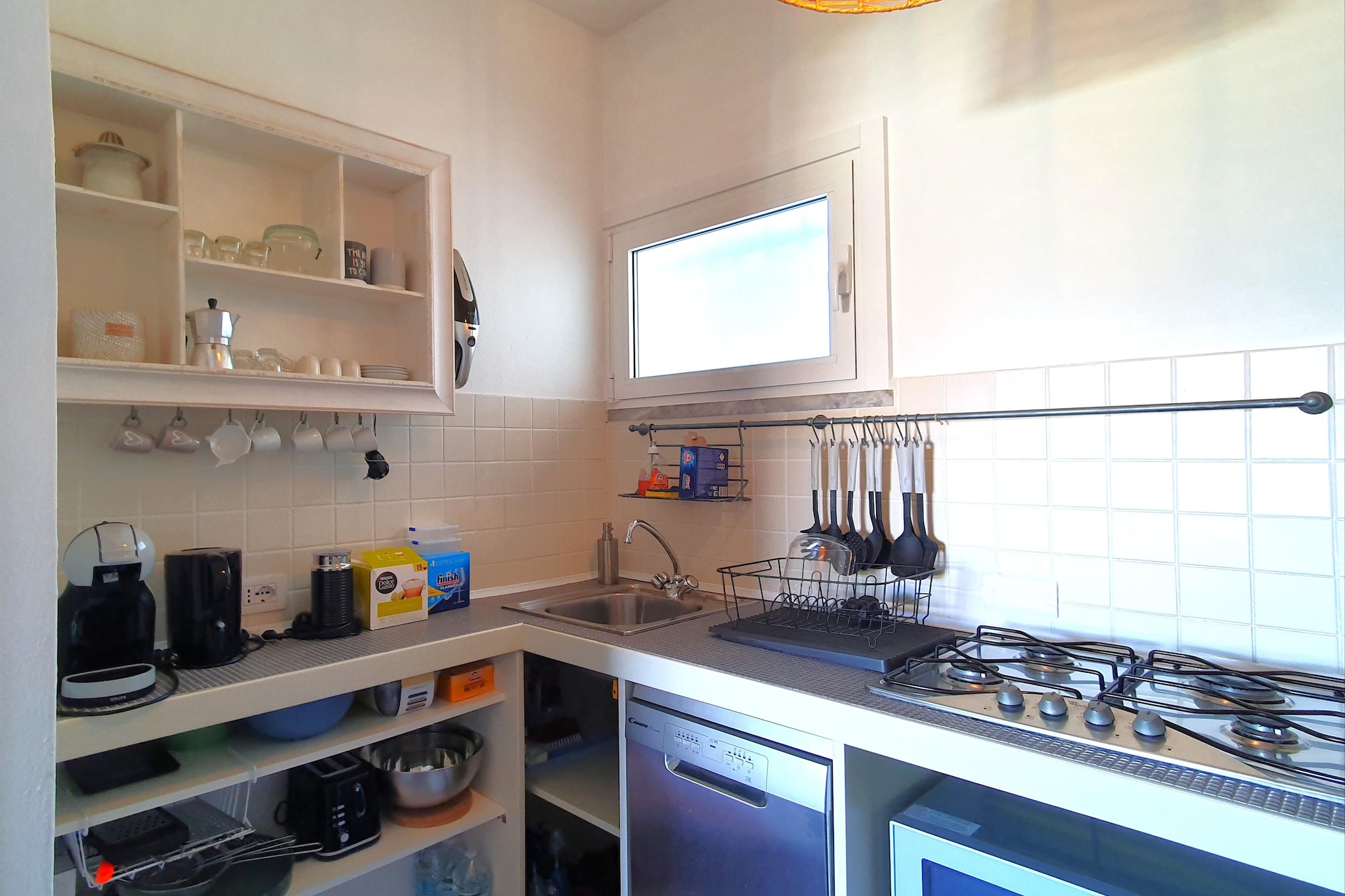 This charming ground-floor holiday home in Germignaga offers a peaceful and comfortable stay just 400 meters from the town center and under 1 km from the shores of Lake Maggiore. Perfect for families or couples, the property features a bright living room with satellite TV, air conditioning, and a cozy dining area, ideal for relaxing after a day of sightseeing.

The home includes two comfortable double bedrooms and a modern bathroom with a shower and hairdryer. The well-equipped open kitchen comes with a gas hob, microwave, dishwasher, toaster, and kettle. For outdoor dining, enjoy a fully functional outdoor kitchen, BBQ, a private terrace, and a fenced garden with sun loungers and patio furniture, offering privacy and comfort. On-site private parking is available for added convenience.

Germignaga is an excellent base to explore the beauty of Lake Maggiore. Visit nearby Luino, known for its lakeside market, or take a short drive to the picturesque Borromean Islands. Enjoy local flavors at nearby eateries like Ristorante Sole or La Vecchia Torre. Whether youâ€™re planning boat trips, hiking in the surrounding hills, or simply relaxing by the lake, this property offers a perfect balance of serenity and access to Northern Italyâ€™s highlights.