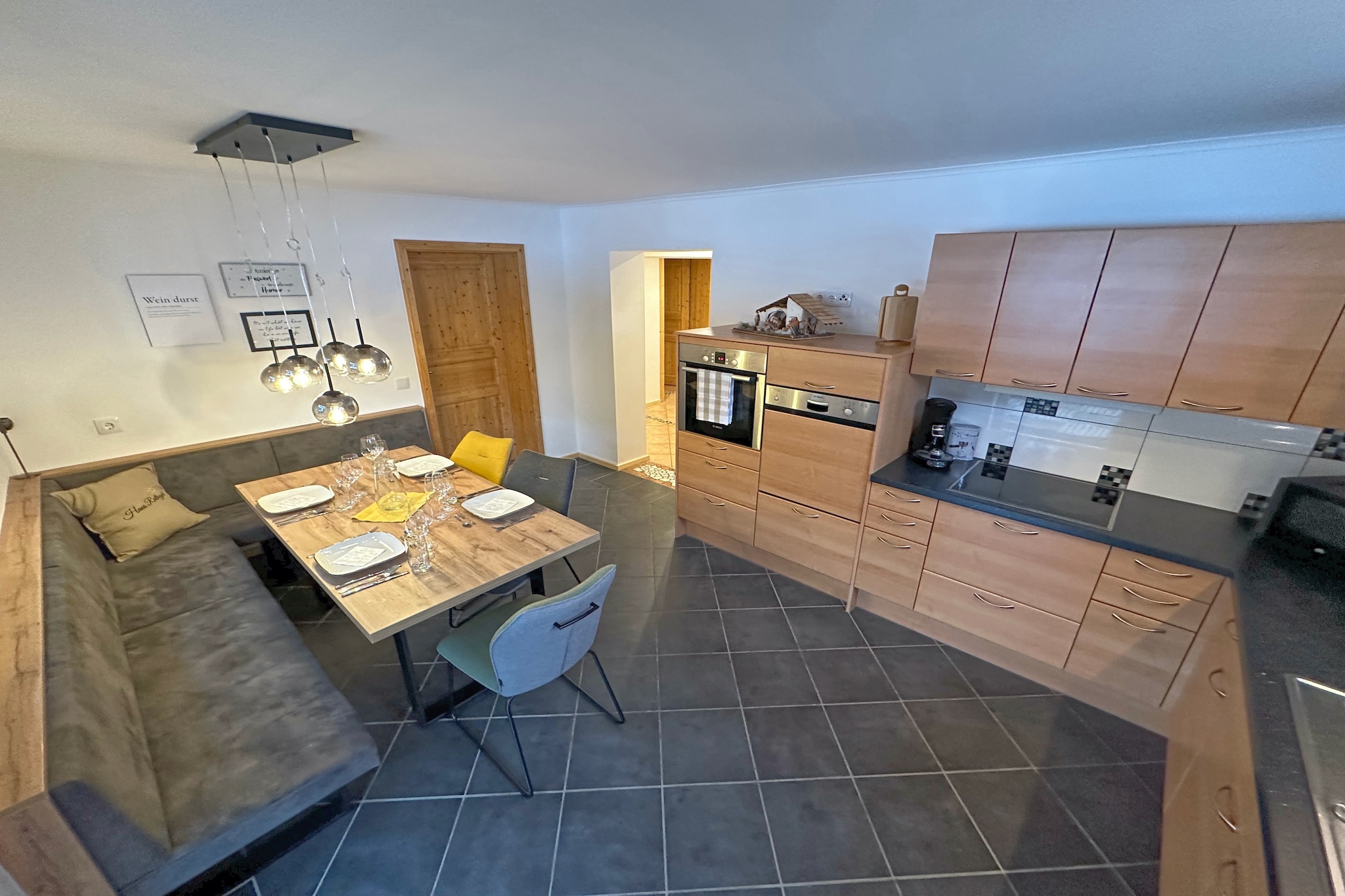 Ground floor: (Entrance, Living room(TV(cable, flatscreen), seating area, CD player), dining room(dining table), open kitchen(electric kettle, toaster, cooker(4 ring stoves, ceramic), hood, coffee machine(pads), oven, microwave, dishwasher, fridge-freezer), bedroom(single sofa bed, double bed, TV(cable, flatscreen)), bedroom(double bed, TV(cable, flatscreen)), bedroom(double bed, TV(cable, flatscreen)), bathroom(shower, washbasin, washing machine, hairdryer), toilet, Landing)\n\ncot, infrared sauna, washing machine(paid), heating(floor heating), terrace(private, roofed, 50 m2), garden(private, partially fenced, 50 m2), bicycle storage, garden furniture, parking, deckchairs, slide, high chair, ironing board, iron, party games, Sunscreen, Swing set