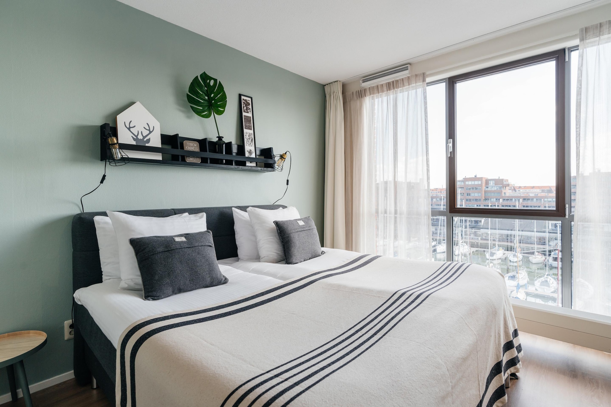 Ground floor: (Kitchen(hob, electric kettle, hood, coffee machine(cups, espresso), oven, microwave, dishwasher, fridge), Living/diningroom(TV(flatscreen, smart TV, international television channels), dining table, balcony), bedroom(single bed(boxspring), single bed(boxspring), TV(flatscreen, smart TV, international television channels), balcony), bedroom(2x single bed(boxspring), TV(flatscreen, smart TV, international television channels), balcony), Bedroom with bathroom(single bed(boxspring), single bed(boxspring), shower), bathroom(bath tub, shower, washbasin, toilet), toilet(washbasin, toilet), Internet access)\n\ntumble dryer, washing machine, heating, parking, lift, ironing board, iron, hairdryer