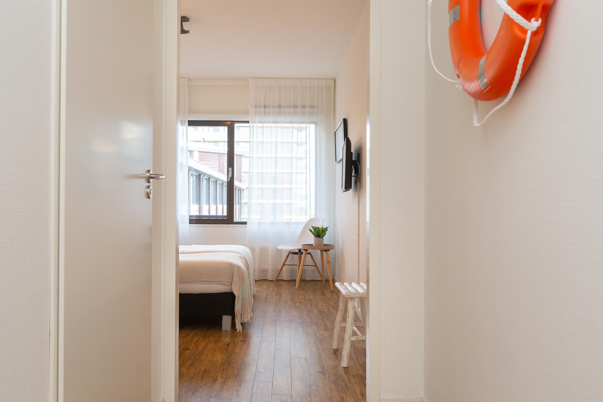 Ground floor: (Kitchen(electric kettle, cooker, hood, coffee machine, oven, microwave, dishwasher), Living/diningroom(TV(smart TV), dining table, seating area), bedroom(single sofa bed, single sofa bed, double bed(boxspring), TV), bathroom(shower, washbasin), toilet(toilet), Internet access)\n\ntumble dryer, washing machine, balcony, heating, bicycle storage, garden furniture, parking, lift, ironing board, hairdryer