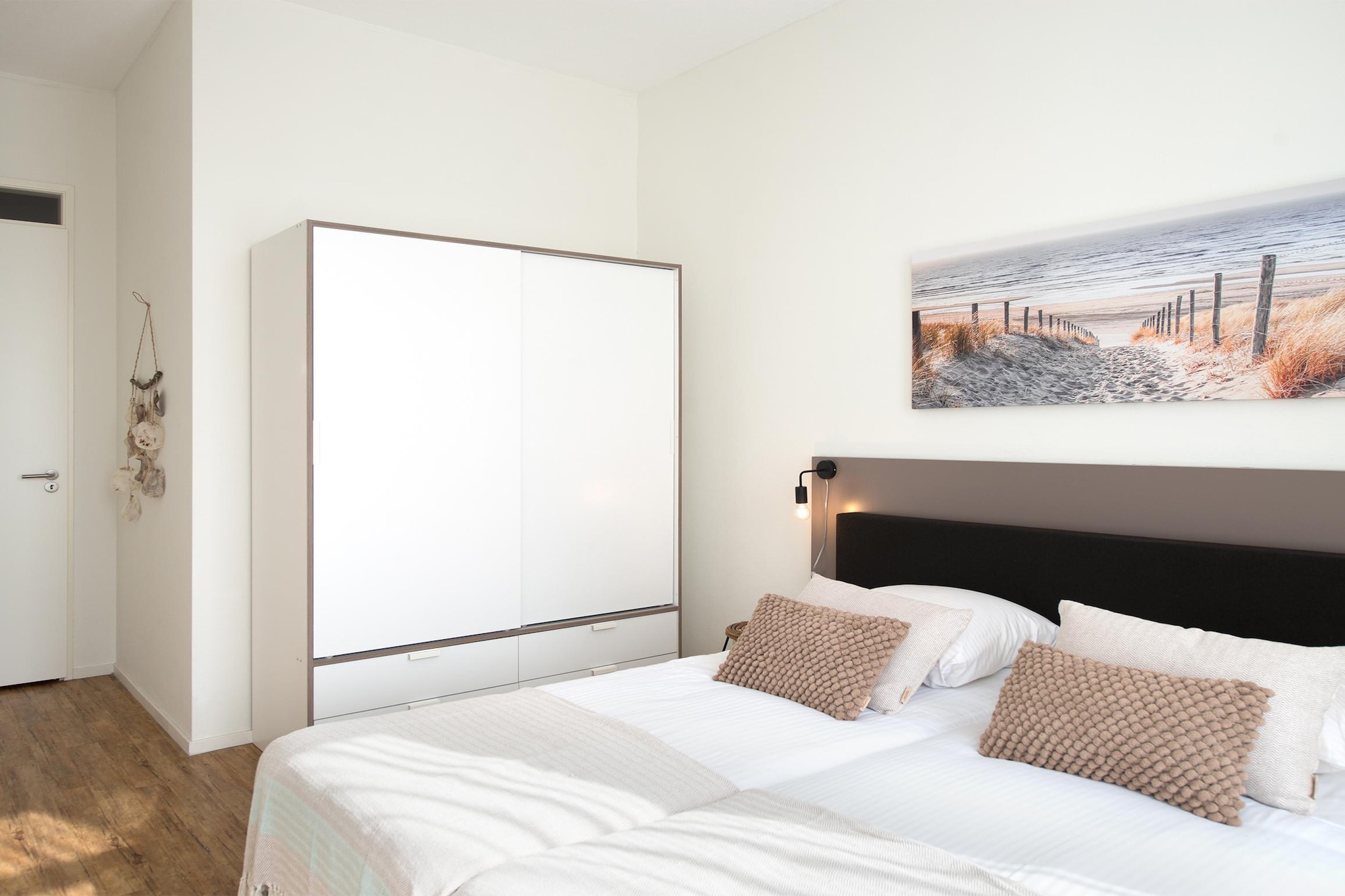 Ground floor: (Kitchen(electric kettle, cooker, hood, coffee machine(espresso), oven, microwave, dishwasher), Living/diningroom(single sofa bed, single sofa bed, TV(smart TV), dining table, seating area), bedroom(double bed(boxspring), TV), bathroom(shower, washbasin), toilet(toilet), Internet access)\n\ntumble dryer, washing machine, balcony, heating, bicycle storage, garden furniture, parking, lift, ironing board, hairdryer