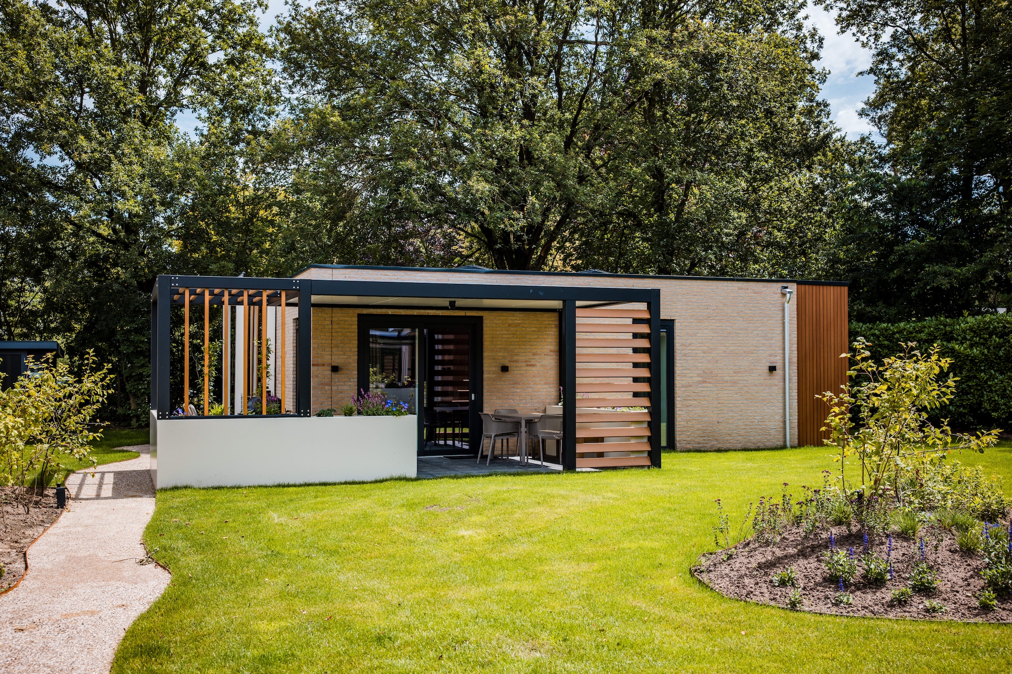 Ground floor: (Living room(TV, dining table(6 persons), seating area), Kitchen(hob, electric kettle, coffee machine, oven, microwave, dishwasher, fridge, freezer, dishes and cutlery, Cooking basics), bedroom(double bed), bedroom(double bed or 2 single beds), bedroom(bunk bed), bathroom(shower, washbasin), toilet)\n\nsauna(shared with other guests), terrace, garden, garden furniture, parking, swimming pool(shared with other guests), table tennis table(shared with other guests), playpen, Surveillance camera