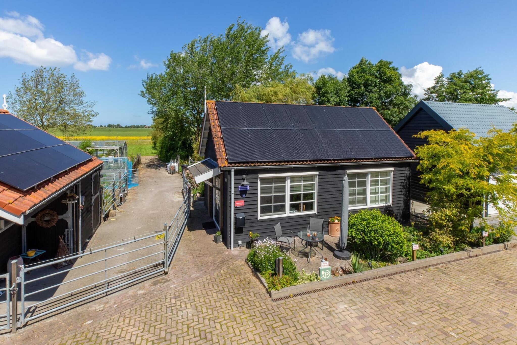 Achterweg 10 l Zonnemaire 'Sol e Mar' - Buitenkant zomer