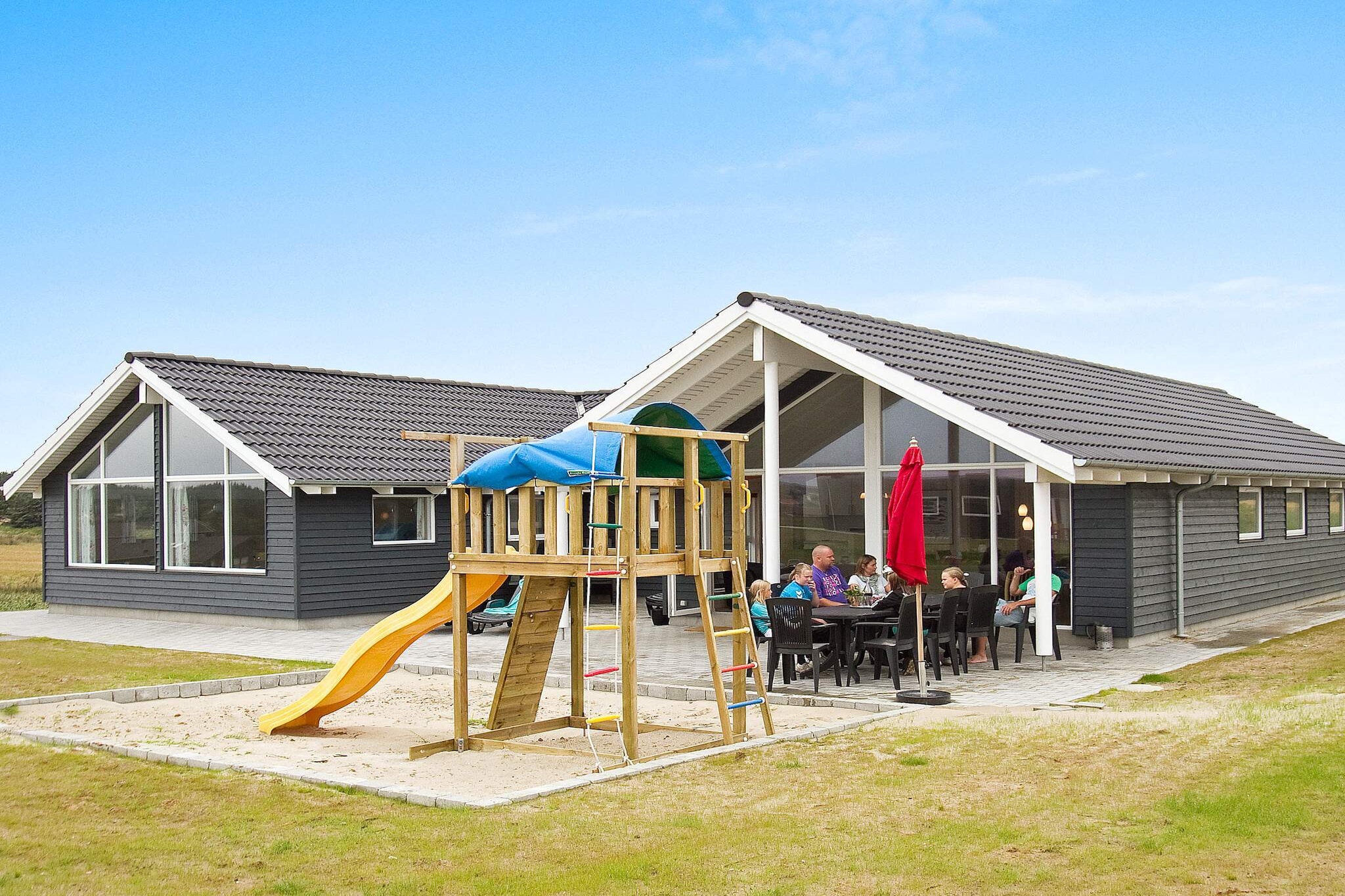 Close to the beautiful beach at Nr. In Lyngby, you will find this vacation home with its own swimming pool, hot tub, and various activities for up to 14 people. The beautiful pool area features a 15 mÂ² swimming pool with a water slide and integrated swimming trainer. The pool area also has a large hot tub and a bathroom with comfortable underfloor heating and a sauna. In addition to the many hours you can spend in the pool area of the vacation home, the house has even more to offer. Among other things, there is a fully equipped activity room with billiards, table tennis, table soccer, PlayStation 4, and darts for your leisure enjoyment. In the living room, you can look forward to movie nights in the home theater, which consists of a 65-inch OLED TV and an Atmos surround soundbar with subwoofer and rear speakers. The kitchen, which is connected to the living area, includes an electric stove, dishwasher, refrigerator, microwave, and freezer. The vacation home is spacious and equipped with five bedrooms and a loft (Hems) with space for overnight guests. Outside, there is a large terrace area where you can enjoy the sun in comfortable garden furniture. The natural grounds surrounding the house also provide fun for the youngest guests with swings, a sandpit, and a trampoline (use at your own risk). Not available for rental to youth groups!