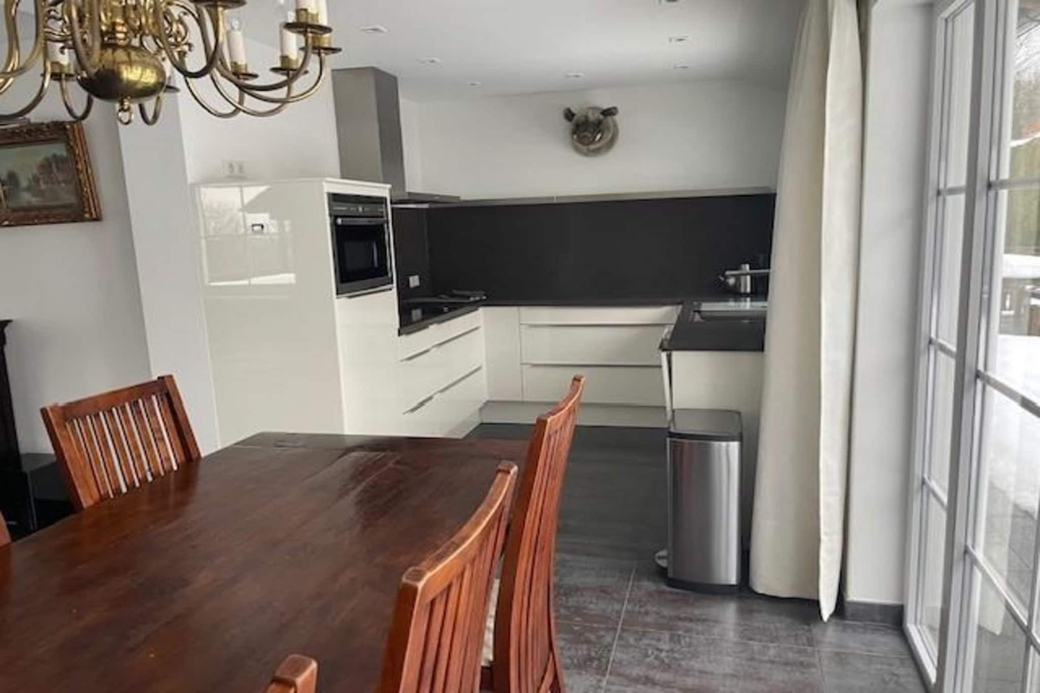 On the 1st floor: (Living room(TV(flatscreen), dining table, seating area), open kitchen(electric kettle, cooker, coffee machine(cups, filter), oven, combination microwave, dishwasher, fridge, freezer), bedroom(double bed), bedroom(single bed), bedroom(bunk bed), bedroom(3-person bunk bed), bathroom(bath tub, shower, washbasin, toilet, hairdryer), toilet(washbasin), Landing)\n\ncot, terrace, garden(shared with other guests), garden furniture, trampoline, table football, high chair, party games, Garden shed, Swing set, playstation