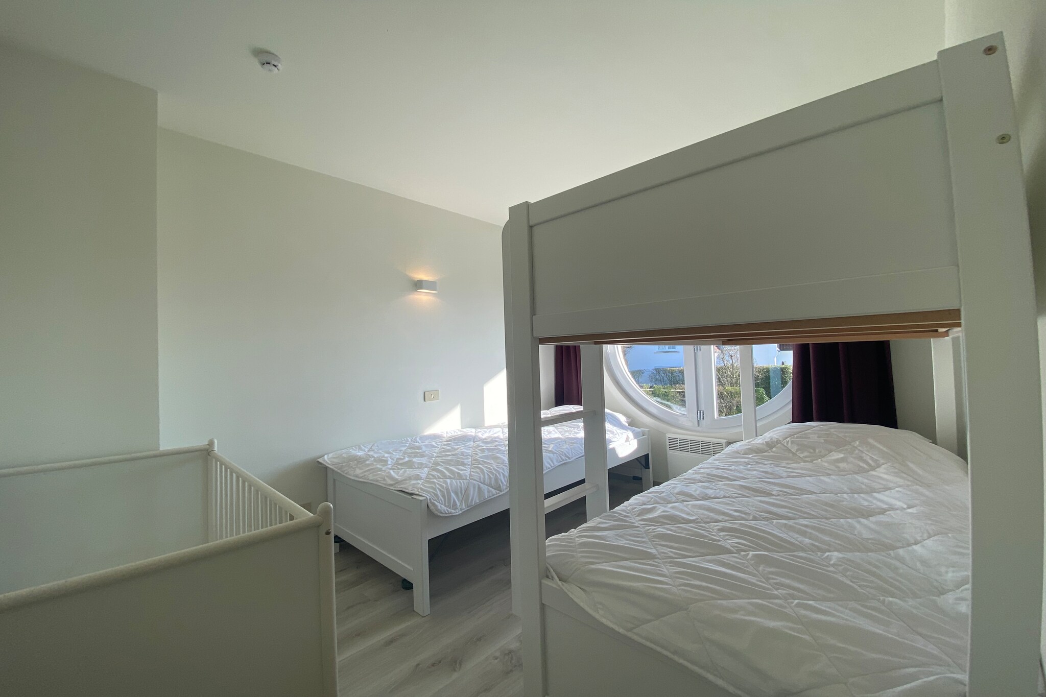 On the 1st floor: (Kitchen(cooker(electric), coffee machine, combination microwave, dishwasher, fridge-freezer), Living/diningroom(TV(digital), dining table, seating area), bedroom(double bed(160 x 200 cm)), bedroom(single bed, bunk bed), bathroom(bathtub with shower, washbasin, toilet), bathroom(shower, washbasin), toilet(toilet))\n\ngarage, terrace, children\'s bed, high chair