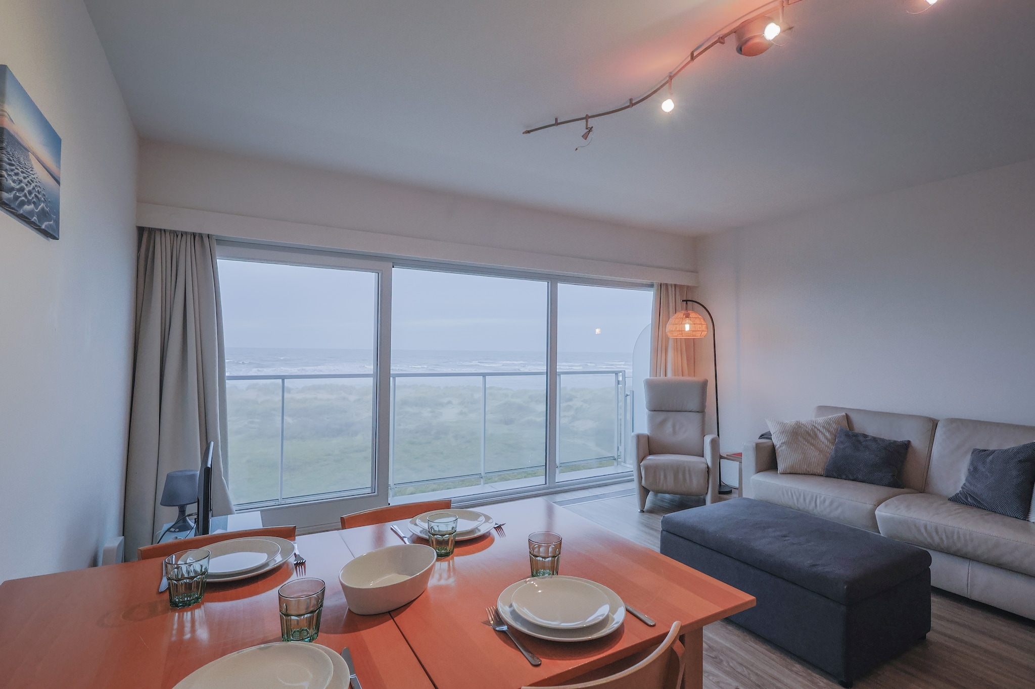 This modern studio offers a comfortable and stylish stay for up to four guests. Recently renovated, it features a contemporary design with cozy sleeping arrangements that ensure restful nights. Large windows provide a breathtaking sea view, creating a serene atmosphere. The property is ideal for those looking to unwind in a peaceful coastal setting. While pets are not allowed, the studio promises a fresh and allergen-free environment. Its prime location near the beach and dunes makes it an excellent choice for a relaxing getaway.
Situated directly by the sea, this studio offers easy access to stunning beaches and scenic dunes. Guests can take leisurely walks along the coastline or explore charming local cafés and restaurants just a short distance away. Nearby markets provide fresh produce and regional specialties, perfect for those who enjoy local flavors. The area also offers various recreational activities, including cycling, water sports, and nature trails, making it an excellent destination for outdoor enthusiasts.
The studio is thoughtfully equipped with essential amenities for a hassle-free stay. A modern kitchenette allows for easy meal preparation, while a stylish washroom ensures comfort and convenience. The cozy seating area provides a perfect spot to relax and enjoy the sea view after a day of exploration. With its inviting ambiance and excellent facilities, this studio guarantees a memorable and enjoyable coastal retreat.