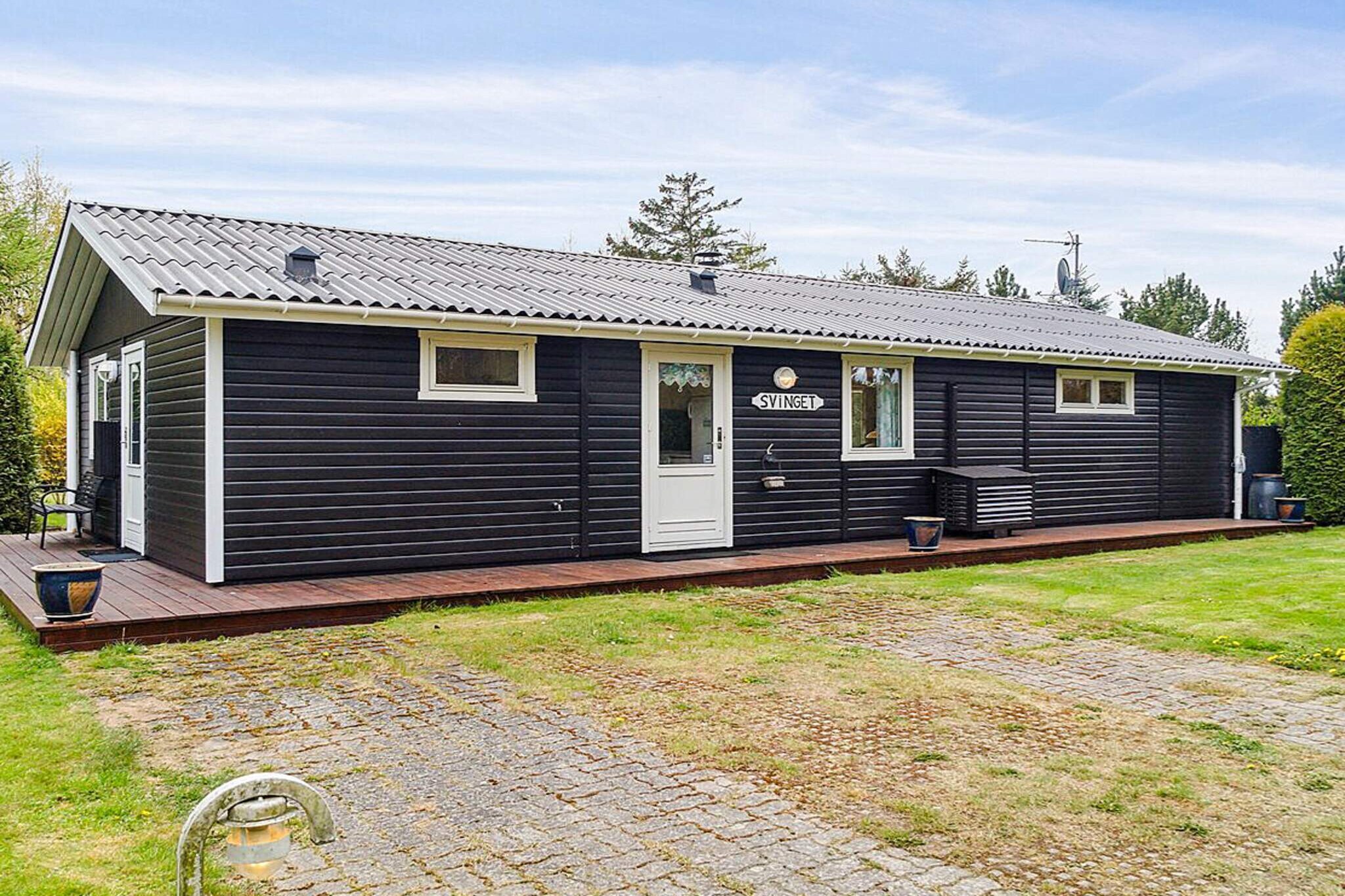 This vacation home is located less than 2,000 meters from the center of NykÃ¸bing SjÃ¦lland and only 1,250 meters from a lovely beach. The house is surrounded by open fields, and from the house and terrace there is a beautiful view of a meadow area. On the south side of the house there is a nice terrace, a large part of which is covered.

The kitchen, dining area, and living room are open plan and form the natural gathering place for socializing and spending time together. The house is suitable for six people. Two of the beds are only suitable for older children (4-11 years). The beds are divided into two double beds and two bunk beds.


The kitchen is equipped with a refrigerator, four ceramic hotplates, a convection oven, and a dishwasher. There is also a washing machine, a 46-liter freezer, and a wood-burning stove. Bathroom with shower.
There is a TV with Chromecast, radio, and wireless internet available. The cottage is also equipped with an energy-saving air-to-air heat pump.

The house is located on a 1297 mÂ² garden plot. 20 mÂ² terrace area. There is also a 20 mÂ² covered terrace. Barbecue available. It is 1250 m to the sea. There is a lake 300 m away. The nearest shop is 1800 m away. There is a golf course 2700 m away.

With the house's proximity to NykÃ¸bing SjÃ¦lland, there are plenty of opportunities to explore the town with its rich shopping life, cafes, and restaurants, and the cozy harbor environment.  Not available for rental to youth groups.