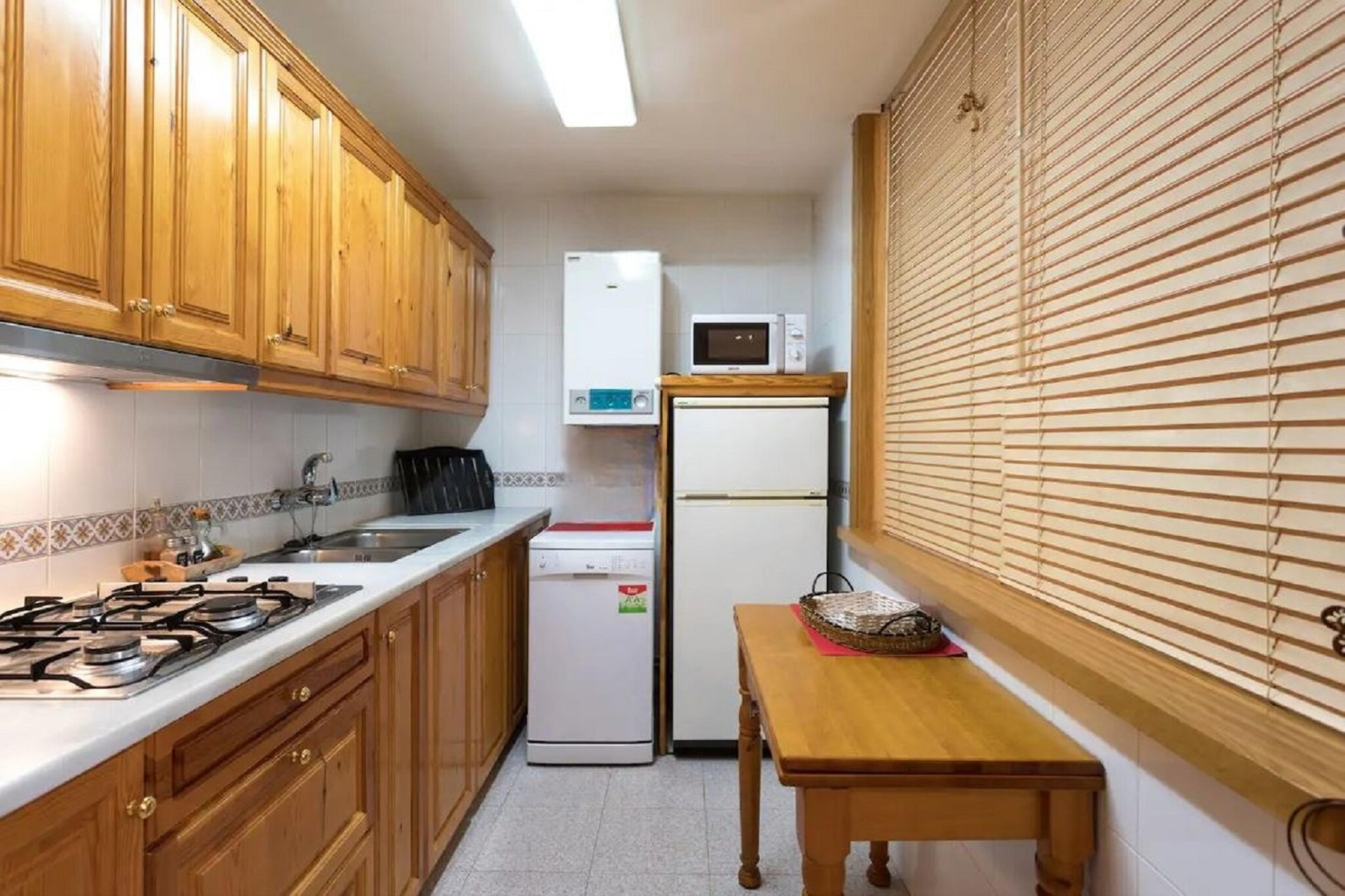 Ground floor: (Entrance, open kitchen(hob, electric kettle, toaster, hood, coffee machine, oven, microwave, dishwasher, fridge-freezer, washing machine, Juicer), Living/diningroom(double sofa bed, TV(flatscreen), dining table, fireplace, seating area), bedroom(double bed), bathroom(shower, washbasin, toilet, hairdryer), heating, air conditioning)\n\ntoilet(shared with other guests)(washbasin, toilet), relaxation area(shared with other guests, reachable from the outside), dining table, terrace, garden, garden furniture, sun loungers, BBQ(charcoal), parking, parasol, swimming pool(shared with other guests, outside, opened from May upto and including Sep), football goal, high chair