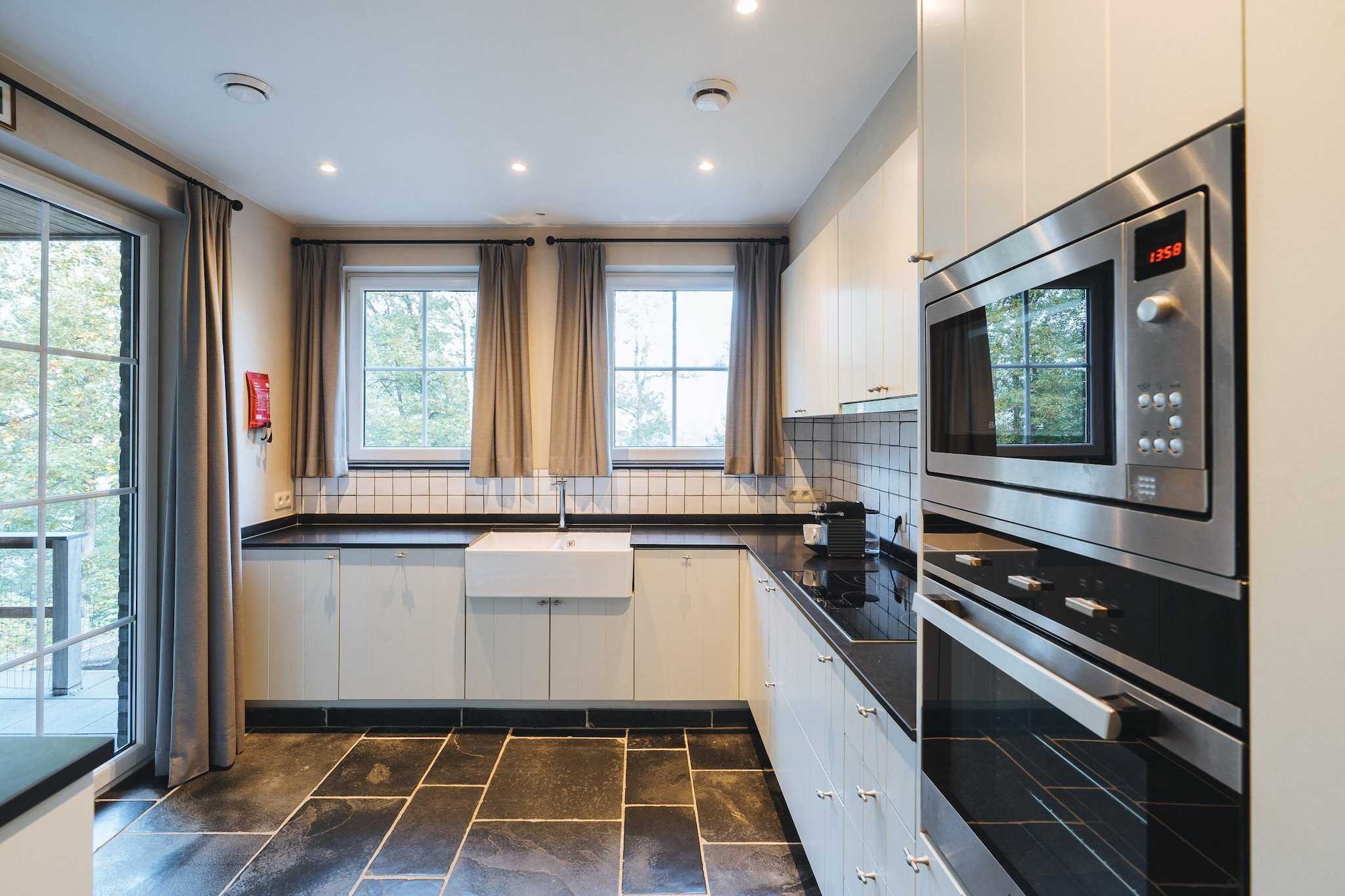 Ground floor: (open kitchen(electric kettle, coffee machine, oven, microwave, dishwasher, fridge-freezer), Living/diningroom(TV, dining table(8 persons), stove(wood), seating area), bedroom(double bed), bedroom(double bed), bathroom(shower, washbasin), toilet(toilet), toilet(toilet))\n\nOn the 1st floor: (Bedroom with bathroom(double bed, shower, washbasin, toilet), Bedroom with bathroom(double bed, shower, washbasin, toilet))\n\ncot, heating(gas), garden, garden furniture, BBQ, parking, boules court, high chair