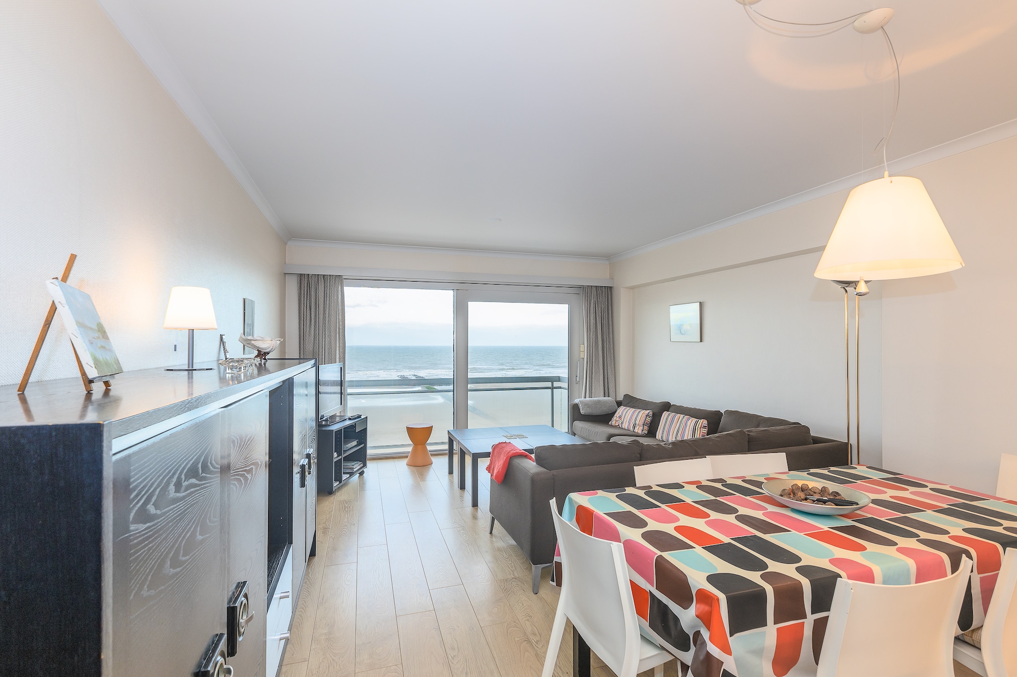 Just 20 meters from the beach, this spacious ground-floor apartment at Zeedijk 275, 8430 Middelkerke offers the perfect blend of comfort and convenience for up to 6 guests. The living room features a TV, dining area, and access to a private balcony and terrace. With WiFi, a private garage, and a lift, itâ€™s ideal for families or groups seeking a relaxing coastal stay.

The apartment includes two bedrooms, one with a double bed and another with two bunk beds, plus two bathrooms with showers and a separate guest toilet. The fully equipped kitchen comes with a coffee machine, juicer, oven, microwave, dishwasher, and fridge-freezer, making it easy to prepare meals at home. A storage room adds extra practicality for longer stays.

Guests also enjoy access to a shared indoor swimming pool, perfect for unwinding after a day at the beach. Located in the heart of West Flanders, this apartment is close to shops, public transport, and the sea promenade. Please bring your own sheets, towels, and duvet covers.