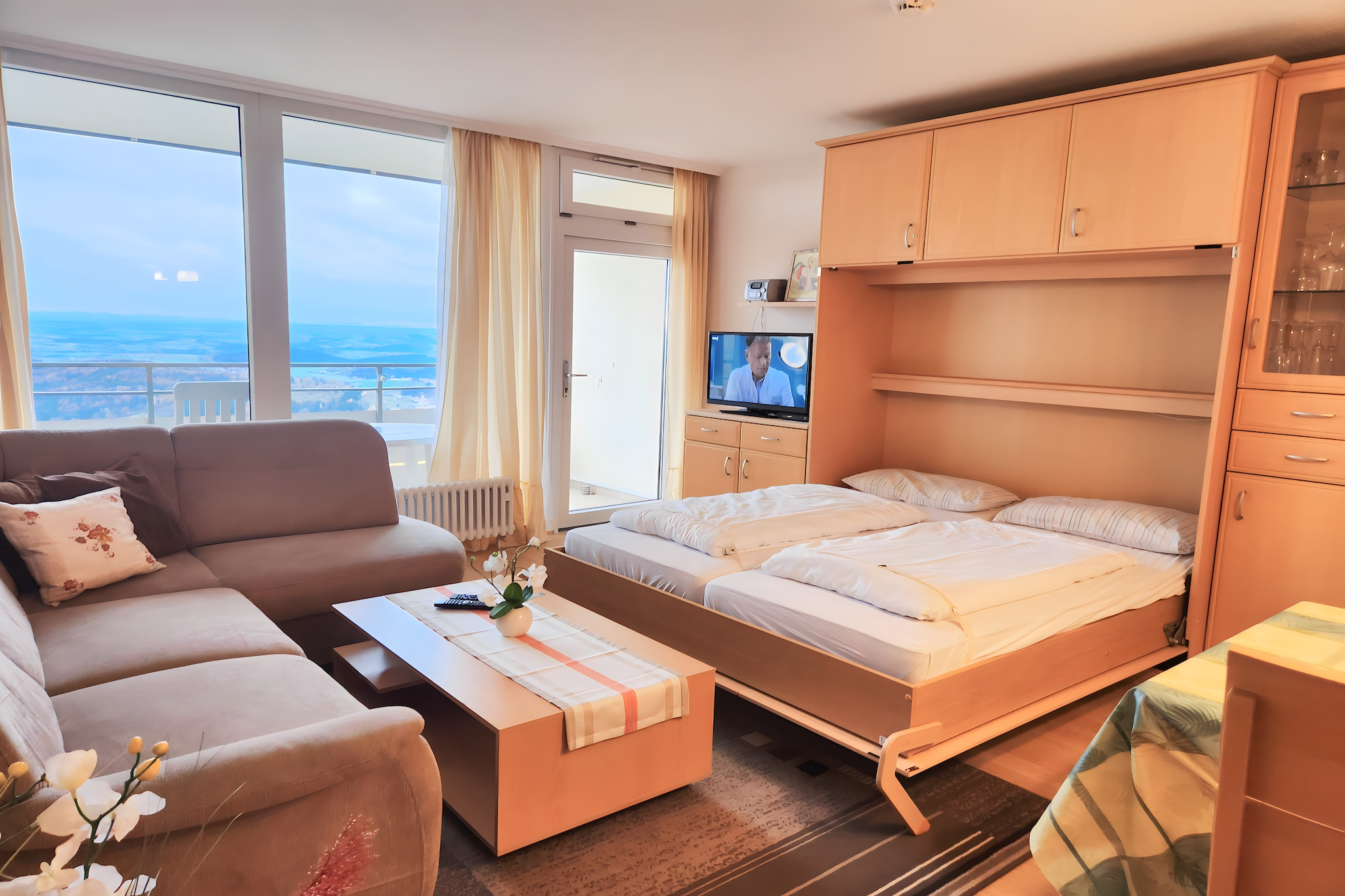 This cozy first-floor apartment in Freyung offers a comfortable stay for couples or small families. It features a bedroom with en-suite bathroom, a living/sleeping area with a single sofa bed and fold-away double bed, and a well-equipped kitchen with microwave, coffee machine, and toaster. A private balcony adds outdoor charm, while shared amenities like an indoor pool, sauna, and garden make it ideal for relaxation.

Guests benefit from thoughtful extras including a cot, high chair, toys, and play equipment. The building includes a lift, table tennis, swing set, and a charging post for electric cars. Paid access to a washing machine and tumble dryer adds convenience, and private parking ensures easy arrival. 

Nearby, visit the Baumwipfelpfad Bayerischer Wald, a treetop walk offering stunning forest views, or explore the glass artistry at Bergglashütte Weinfurtner. Families will love the interactive exhibits at Jagd Land Fluss Museum, while nature lovers can hike the Lusen Mountain. For dining, try Zum Goldenen Steig for Italian fare, Danibauer for rustic Bavarian dishes, or Die Perle Tirols for Austrian specialties.