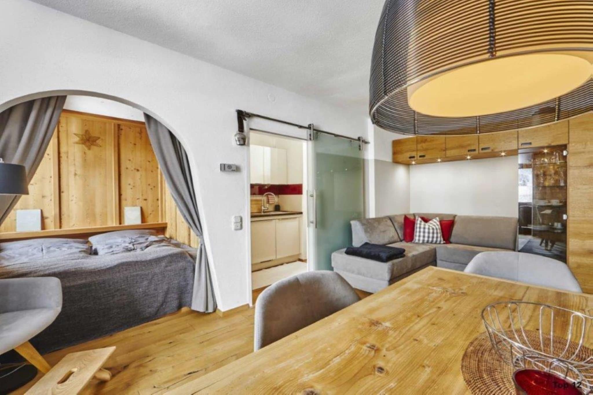 On the 1st floor: (Kitchen(electric kettle, cooker, fridge, washbasin), Living/bed room(single folding bed, TV, dining table, seating area), bedroom(double bed), bathroom(shower, washbasin, toilet), balcony)\n\nski storage, streamingservice, heating, bicycle storage, parking