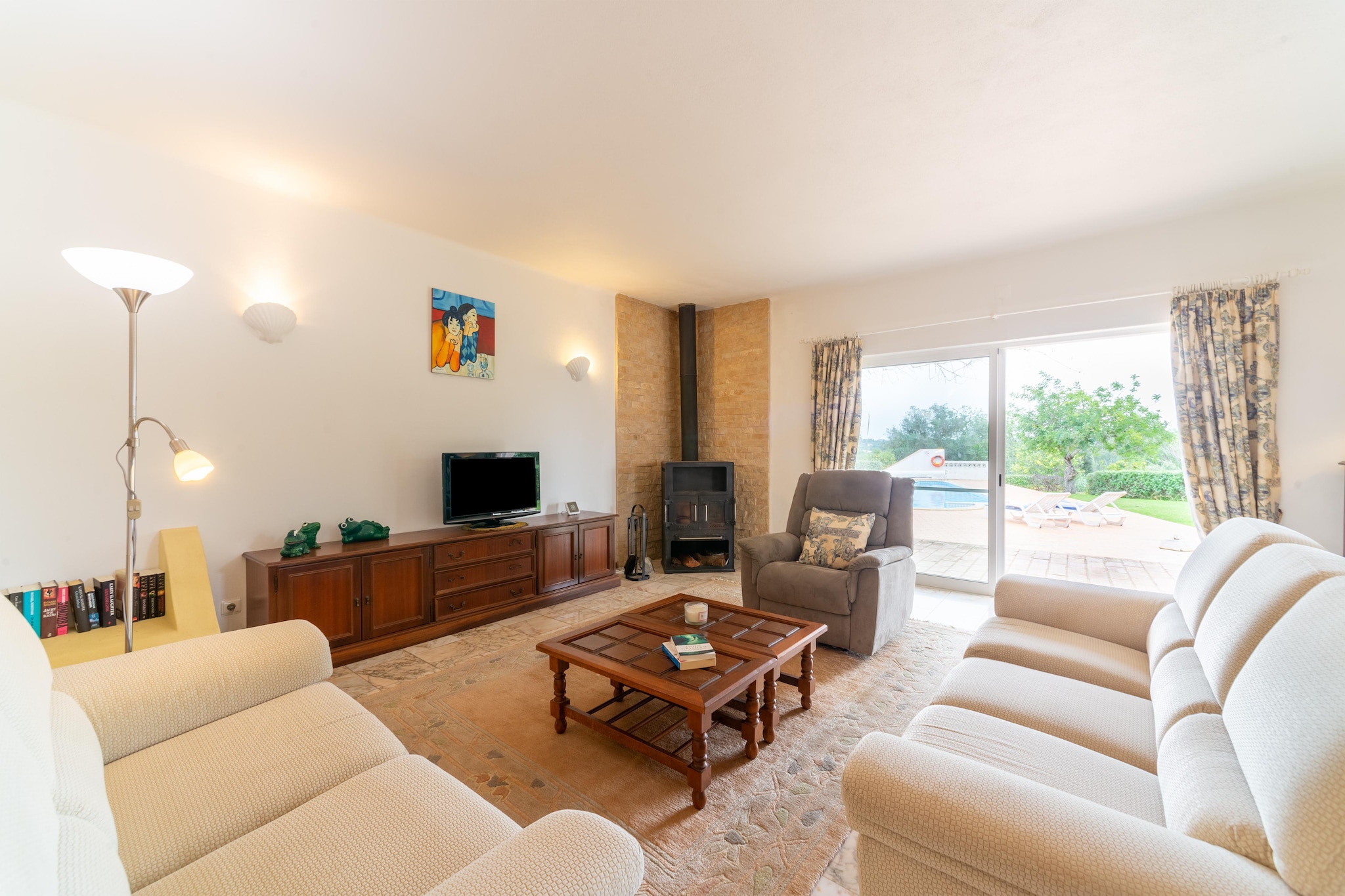 Peaceful Retreat in the Heart of the Algarve
Tucked away in the tranquil village of Poço Fundo – Silves, this charming holiday home offers a peaceful escape surrounded by lush greenery and rolling hills. Designed for comfort and relaxation, the home features a private swimming pool, a spacious terrace for al fresco dining, and a cozy living area with air conditioning throughout. Whether you're sipping morning coffee in the garden or enjoying sunset dinners by the pool, this property is an ideal base for couples or families seeking serenity.
Discover Silves & Algarve’s Natural Beauty
Just a short drive away lies the historic town of Silves, home to one of the Algarve’s best-preserved castles, centuries-old architecture, and a charming riverside promenade. For nature lovers, the nearby Monchique mountains offer panoramic hiking trails and scenic viewpoints. Beautiful beaches such as Praia da Marinha and Armação de Pêra are within easy reach, perfect for a relaxing beach day or a sunset stroll along the coastline.
Savor Authentic Portuguese Cuisine
The surrounding area is rich in culinary delights. Try fresh seafood and grilled specialties at “Marisqueira Rui†or enjoy a cozy dinner at “Café Inglês†with live music and castle views. Local markets in Silves offer fresh produce and regional wines for a true taste of the Algarve. Please note, pets are not permitted in the home, making it an ideal choice for allergy-sensitive guests seeking a quiet, pet-free environment.