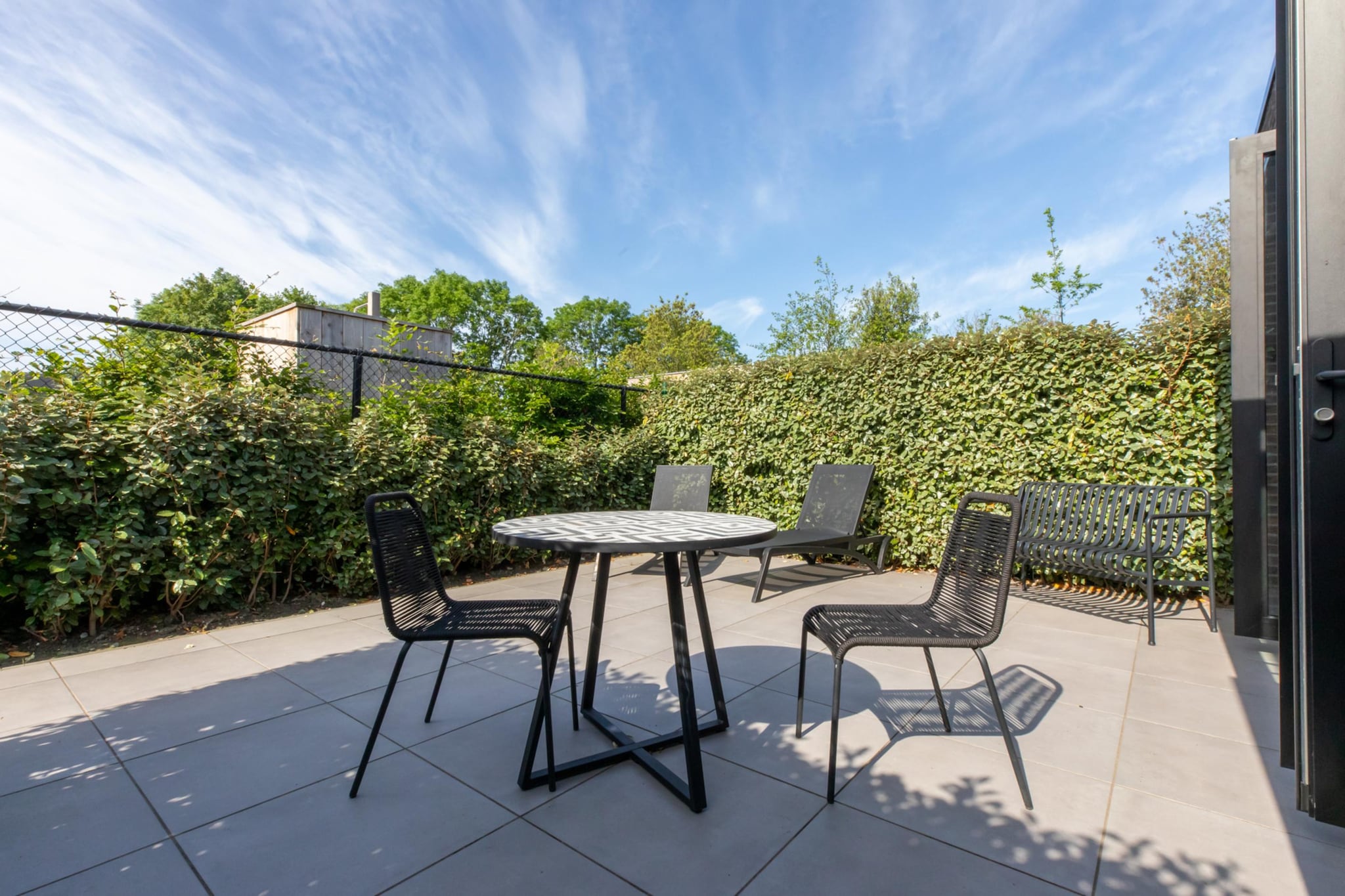 Ground floor: (Living room(TV, seating area, chromecast), Kitchen(espresso machine, combination microwave, dishwasher), bedroom(double bed), bathroom(shower, washbasin, toilet))\n\nterrace, garden, parking