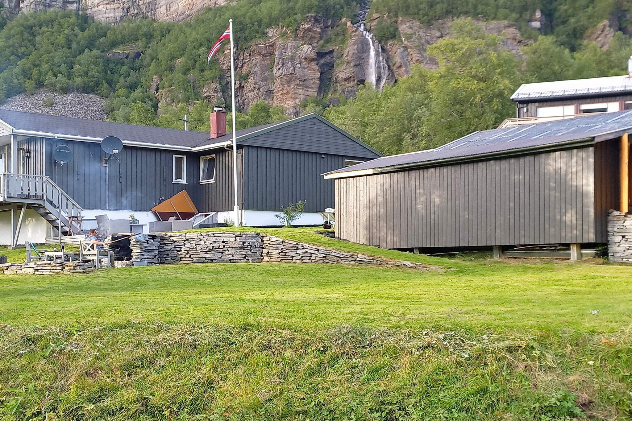 Pleasant holiday home by the fjord at the foot of Saltfjellet Svartisen National Park and just south of the Arctic Circle. Great place for nature lovers and for mountain hiking in a large wilderness area with the glacier Svartisen and Grønligrotta. Many lakes and rivers for great fishing. The house is in the village of Melfjorden, built in 1980 and renovated over several years. Spacious house, pleasantly furnished with living room, dining room, kitchen, bathroom and one bedroom on the main floor with a double bed. 2 bedrooms in the basement, both with family bunk beds that are 1.20 m wide downstairs and single bunks upstairs. One also has a double bed. In the living room, there is a wood stove that provides good heat in the house even on cold days. Satellite TV with many international channels and free internet with fiber cable/large capacity. By the house, there is a great outdoor area with a walled-up barbecue in natural stone and outdoor furniture. The surrounding area is quiet and child-friendly on the outskirts of the village. From the terrace, there is a nice view towards the beautiful mountain landscape to the south and the fjord. Here, you can sit and enjoy your morning coffee. The outdoor area by the house provides great play opportunities for children. 1.5 km to the fish-rich fjord, where you can fish with a rod from the cliffs. The mountain area that surrounds the village is steep, but further east there are marked hiking trails that lead into a magnificent wilderness and high mountain area where impressive waterfalls plunge down the mountainside. Svartisen is Norway's second largest glacier with the Austerdalsbreen glacier arm as the southern part and can be experienced by following the road into Svartisdal where a boat enters the glacier. Grønligrotta is the Nordic region's most famous and visited marble cave and is well laid out with lighting, passages and stairs, a great experience for the whole family. In summer and autumn, Melfjord is a great place for picking berries and mushrooms, and the area has great terrain for small game hunting. Good parking space. 48 km to grocery store, 60 km to the town of Rana.