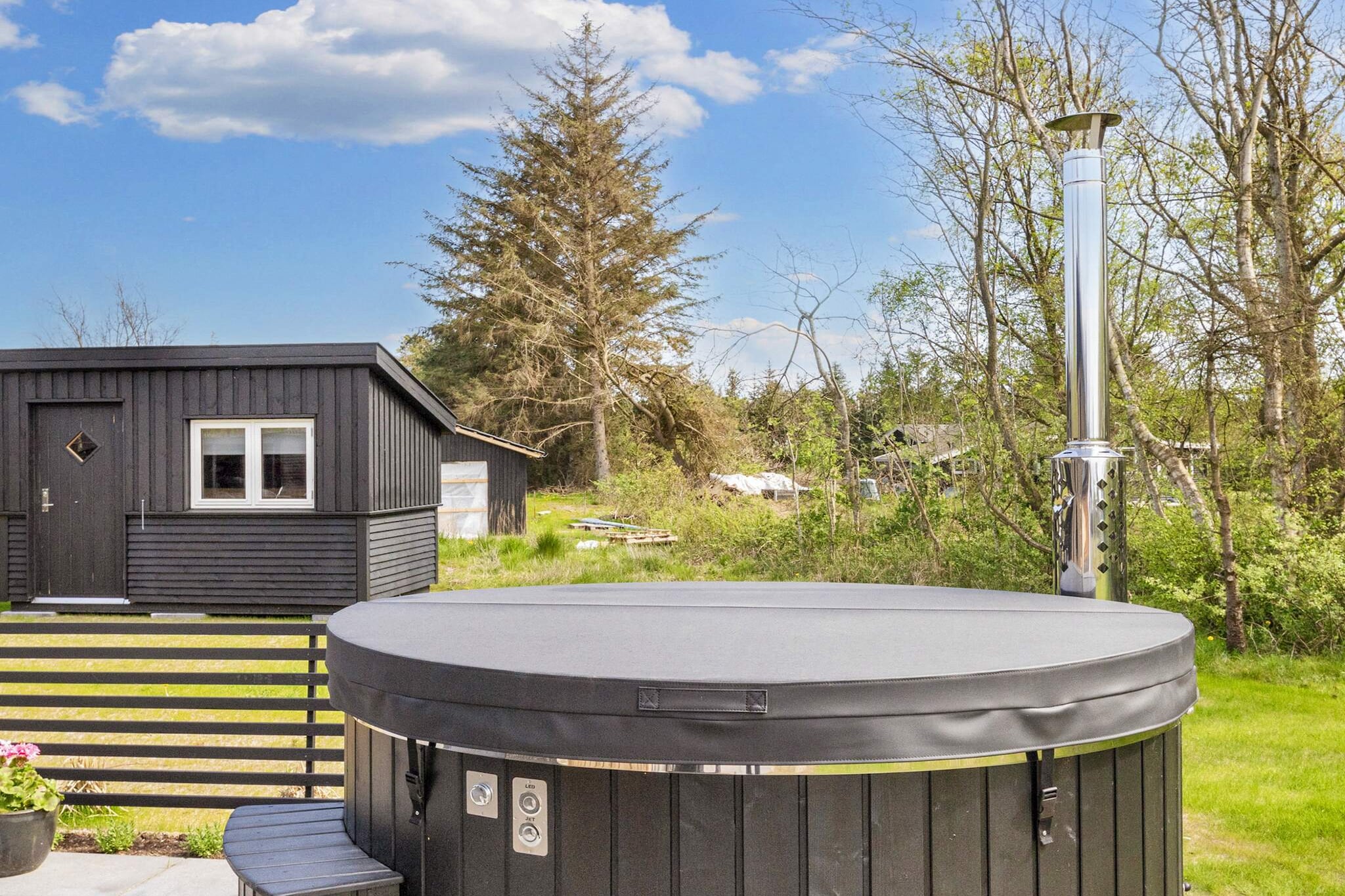 Annex: (2x single bed)\n\nKitchen(cooker(2 ring stoves), coffee machine, oven, microwave, dishwasher, fridge, freezer(100-139L)), Living/bed room(TV), bedroom(double bed), bedroom(double bed), bathroom(washbasin, shower, toilet), bath tub(outside, heated, 6 persons), heating(electric), terrace, garden furniture, sun loungers, table football, air hockey, darts, billiards, air to air heatpump