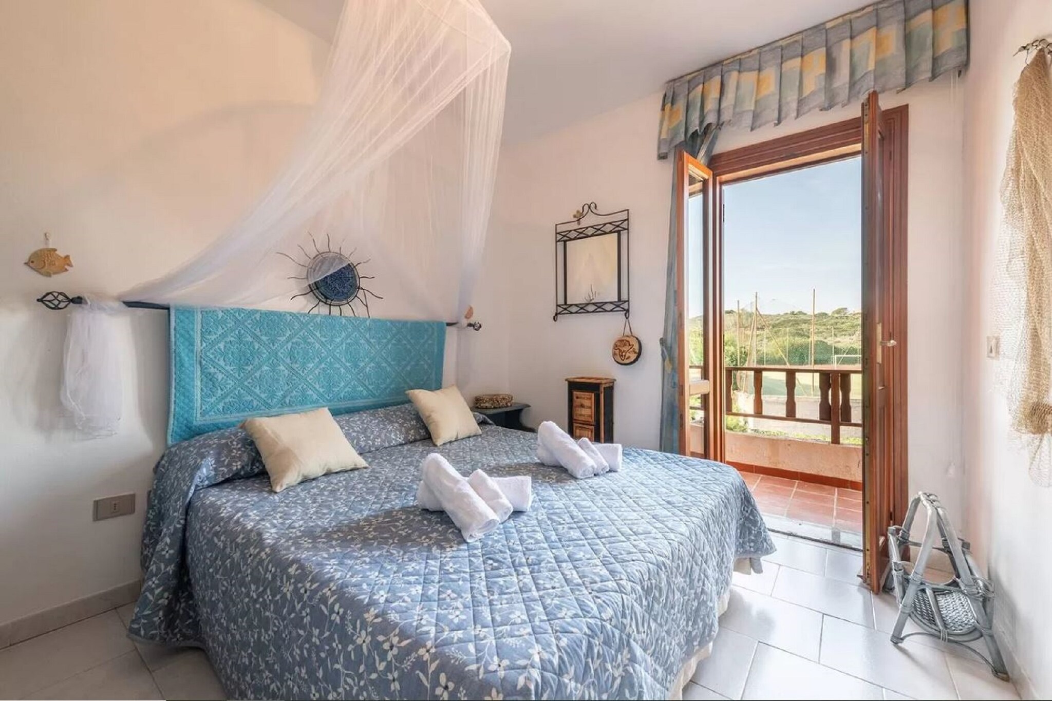 On the 1st floor: (Living room(double sofa bed, TV, seating area), open kitchen(hob, oven, fridge, washbasin), bedroom(double bed), bathroom(shower, washbasin, toilet, bidet), dining table, terrace(roofed), BBQ)\n\nparking