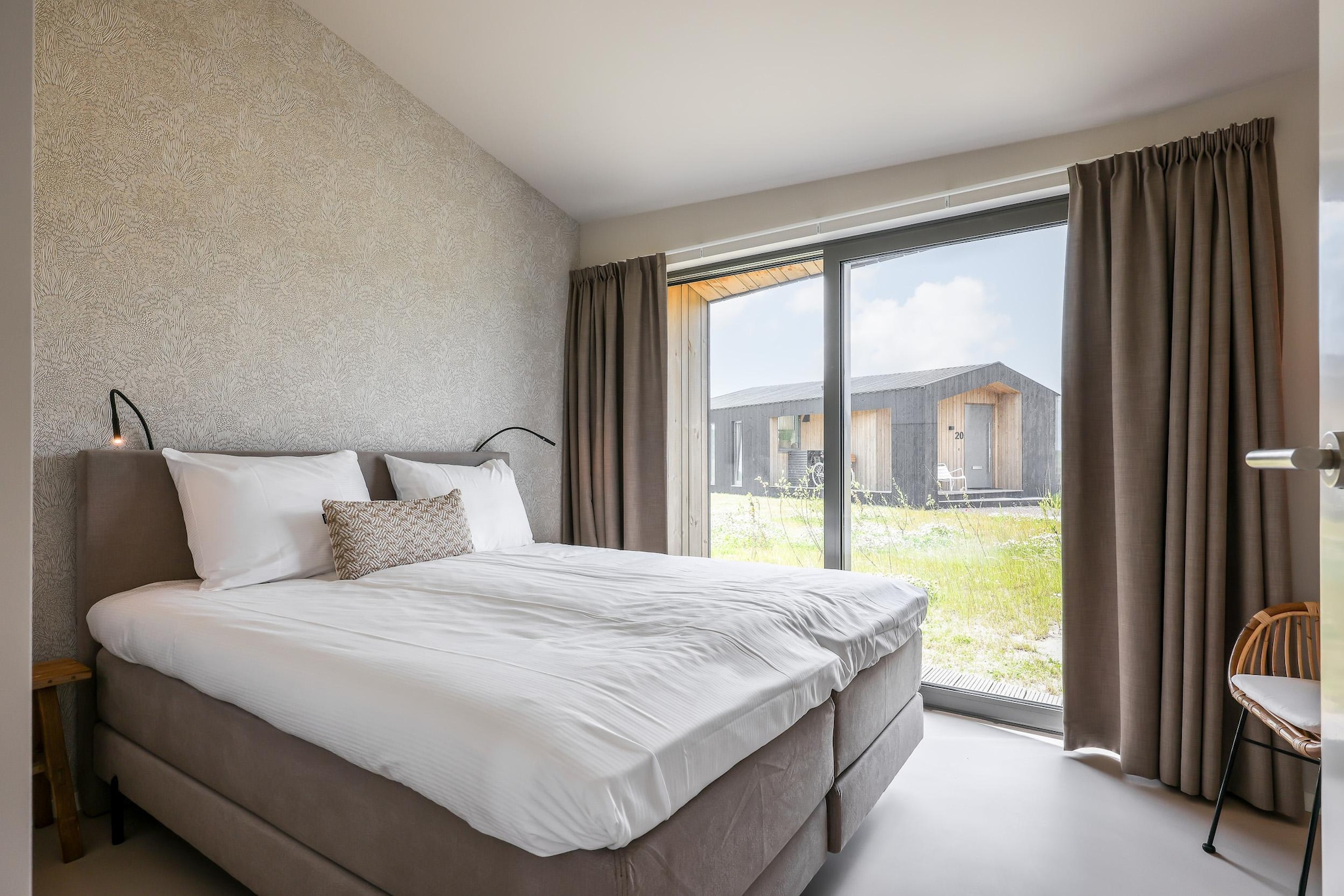 Ground floor: (Kitchen(cooker, coffee machine, oven, dishwasher, fridge), Living/diningroom(TV, seating area), bedroom(double bed), bedroom(double bed), bedroom(bunk bed or 2 single beds), bathroom(shower, washbasin, toilet), bathroom(shower), toilet(toilet))\n\nterrace, garden, parking