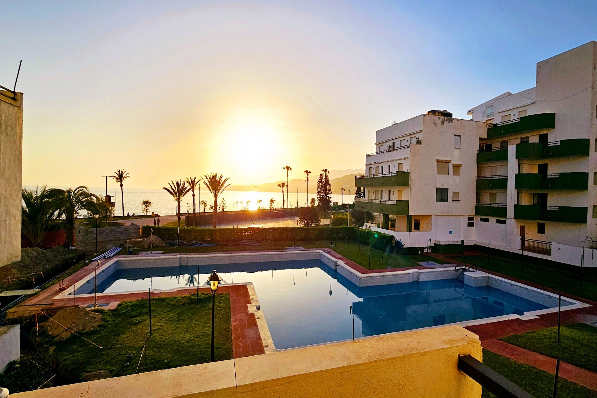 An optional utilities and service fee of EUR 40,00 will be charged before your arrival. Details are given below.<br> Welcome to Apartment Los Flamencos, your perfect retreat for a relaxing seaside getaway in Roquetas de Mar! This charming, air-conditioned apartment boasts a prime location just moments away from the stunning beaches of Playa Serena and Roquetas de Mar Urbanization Beach. Step outside onto the terrace and soak up the warm Spanish sunshine as you enjoy views of the sparkling outdoor pool and lush garden area. Whether you're lounging by the poolside or dining al fresco on the terrace, you'll find plenty of opportunities to relax and unwind in the tranquil surroundings. The apartment's proximity to Playa Serena and Roquetas de Mar Urbanization Beach means that sun, sand, and sea are just a short stroll away. For those looking to explore further afield, Almería Airport is located just 44 km away, offering easy access to and from the region. As you step inside, you'll be greeted by a bright and spacious living area, complete with comfortable furnishings and a flat-screen TV, perfect for unwinding after a day of exploring the beautiful coastline. The fully equipped kitchen offers everything you need to whip up delicious meals, while the nearby dining area provides a cozy spot to enjoy them. With two bedrooms, this apartment comfortably accommodates up to four guests, making it ideal for families or small groups. Soft towels and crisp bed linen are provided, ensuring a comfortable and restful stay. <br><b> Optional Utilities & Service Package </b><br><b> An optional utilities and service package of EUR 40,00 </b> can be selected prior to your arrival. You will receive a separate communication with the payment link should you wish to include it.<br>This package ensures a seamless stay and conveniently covers services such as final cleaning, utility consumption, service support, and protection against minor damages or incidental costs during your stay.<br>Guests who prefer may manage these services independently, provided the property is returned in good order at check-out.