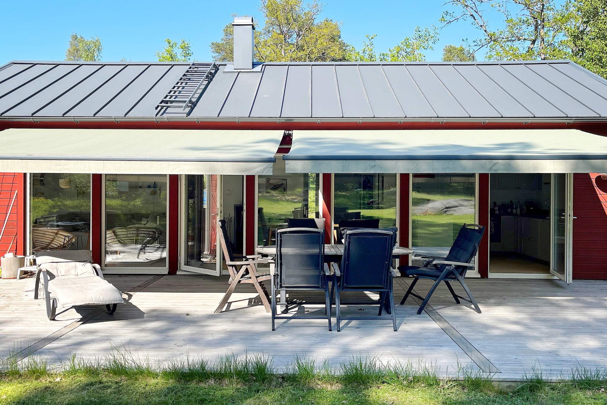 Kitchen(stove(induction), coffee machine, oven, microwave, dishwasher, fridge-freezer, water from well), Living/bed room(double folding bed), bedroom(double bed), bedroom(2x bunk bed), bathroom(washbasin, shower, toilet, washing machine), balcony, parking, play equipment, air to water heatpump