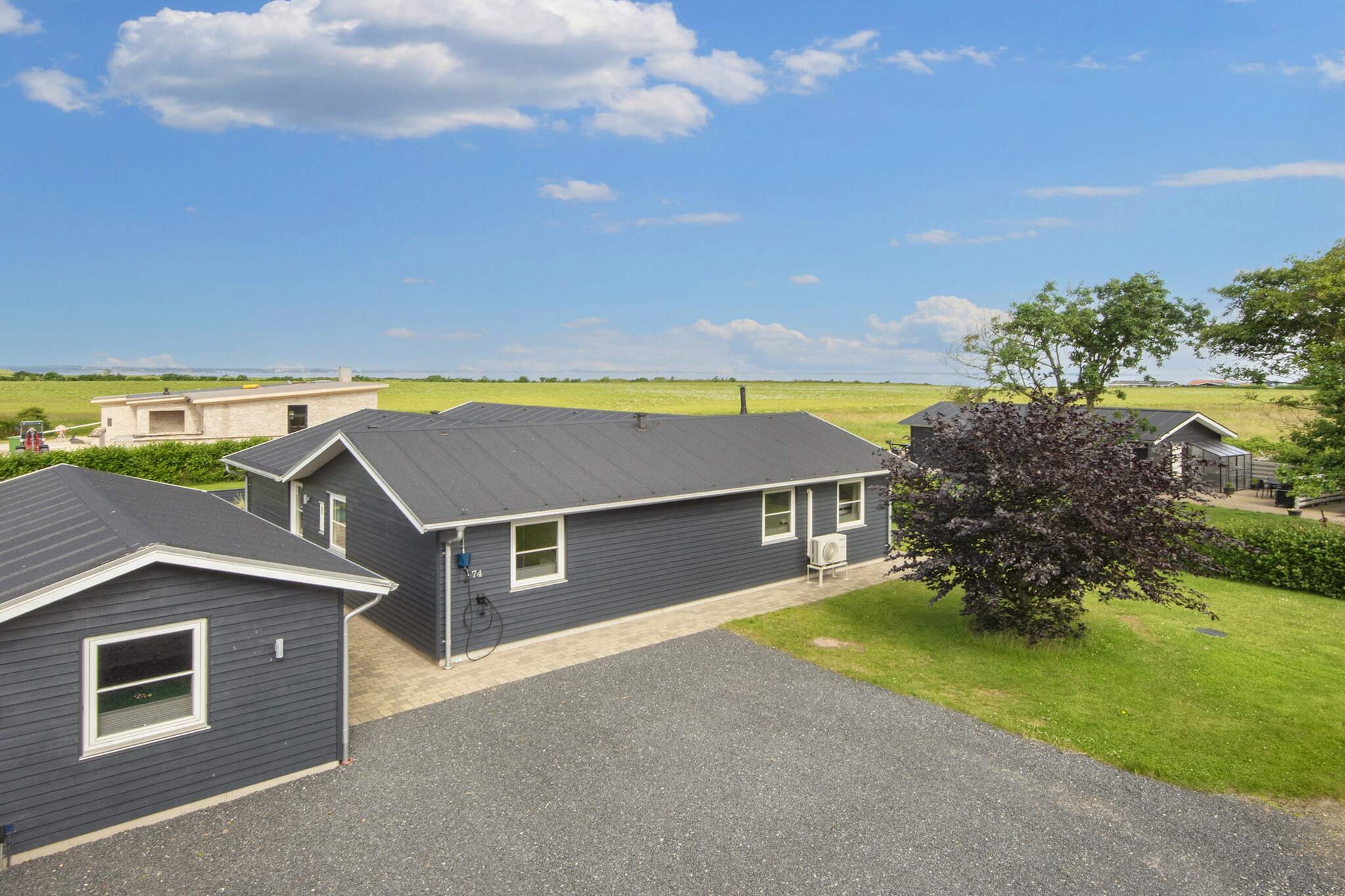 Luxurious architect-designed holiday home, partially renovated in 2024, with panoramic views of the Limfjord, both inside and out, with large 6-person outdoor spa and 2-person indoor spa, etc. located just 350 meters from the fjord with child-friendly beach. The house has new air conditioning in all bedrooms. The house's multi-room (annex) is an experience in itself, with many hours of entertainment for both children and adults, including activities such as billiards, table football, air hockey (turntable version) and electronic darts.  There is a “movie theater†with a large TV and surround sound system where you can stream your own TV services etc. There is also a sofa bed with room for 2 people. The cottage is energy-friendly with 2 heat pumps (air/air), allowing for lower consumption. There is also a charger for electric cars. The cottage is bright and welcoming and oozes quality. The house is practically furnished with a combined kitchen/living room/living room. The quality kitchen includes a ceramic hob, extractor hood, separate oven with grill, microwave, dishwasher, coffee machine and fridge/freezer. The living room has modern furnishings, free high-speed internet and Smart TV with apps where you can stream your own TV services. In addition, German channels via satellite dish. There is a wood-burning stove (pellets) for a cool summer evening or a rainy fall evening. Bright, high-quality bathroom with a 2-seater spa, bathing area, toilet and shower. Guest bathroom with shower and toilet. The cottage has four bedrooms, including 2 double bedrooms, one of which is a double bed (140x200), 1 room with a double bed (140x200) and 1 bunk and 1 room with 2 bunk beds. The house is suitable for 6 adults and 4 children. The utility room has both a washing machine and dryer. There is a weekend bed and high chair for the little ones. The house has a large terrace with good garden furniture, sun loungers and a gas barbecue where you can enjoy dinner while the sun sets over the fjord. This is also where you'll find the 6-person outdoor spa. Please note, no pets allowed! Not available for youth groups and artisan groups. For vacation stays only.A refundable deposit might be charged closer to your check-in date. The security deposit ensures a smooth stay and covers any additional services or consumption charges.This deposit covers utilities consumed during your stay and any additional services that may be taken.The final amount will be adjusted based on actual meter readings, actual usage of extra services, and any remaining balance will be refunded within 21 days after checkout.This deposit simply acts as a prepayment for charges that  you would anyways pay for, ensuring a seamless stay and check-out experience.