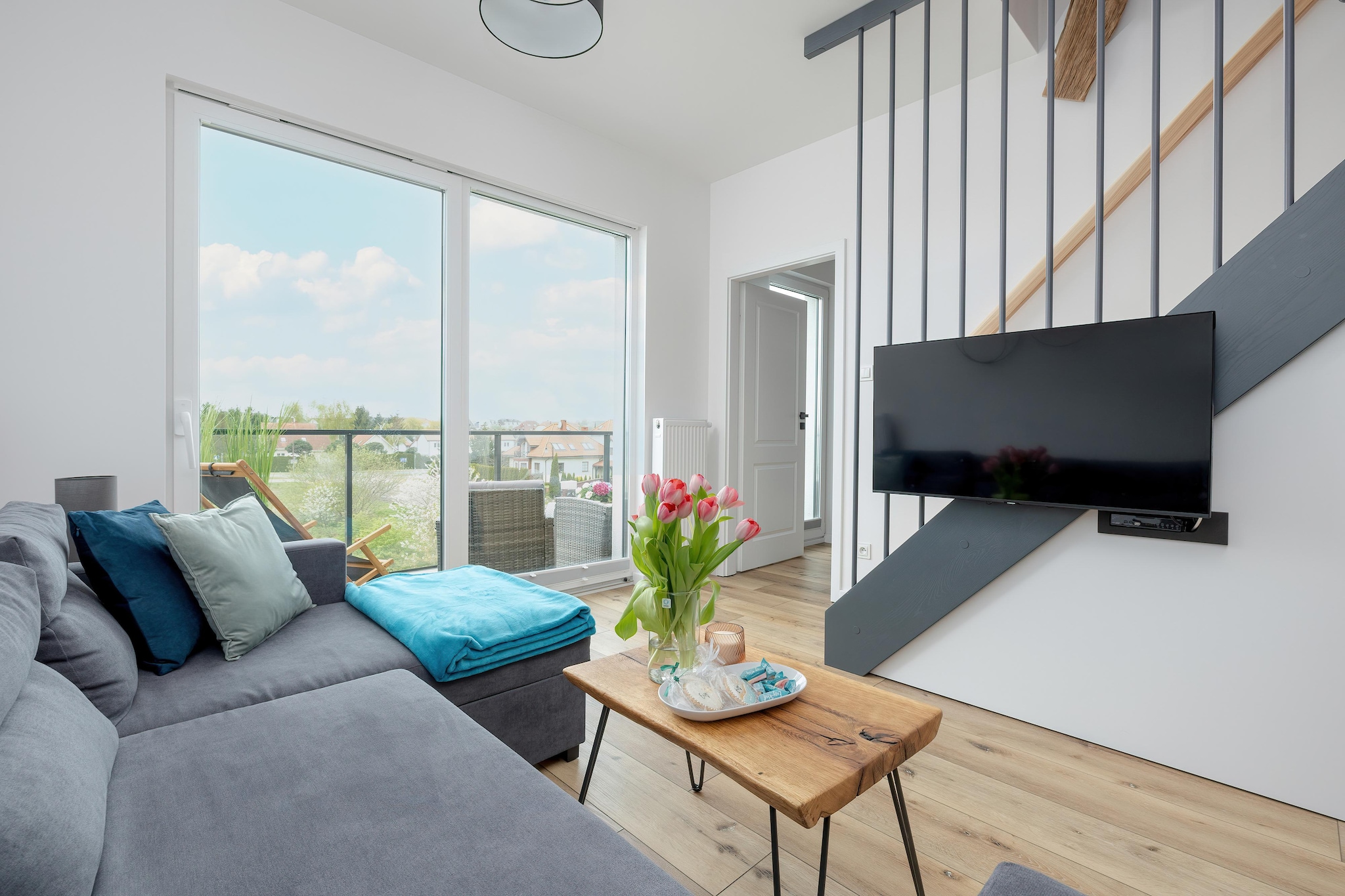 An intimate apartment building on the outskirts of the resort, in a quiet area, close to a large grocery store. The beach is about 900 m away. The town center is about 500 m away.
A comfortable, 2-level apartment provides comfortable relaxation for up to 8 people. The lower level is located on the second floor of the building. On the lower level there is a spacious living room connected to the kitchen, a bedroom with a double bed and a bathroom with a shower (there is a washing machine). The living room has a 2-seater sofa, TV and a table with chairs. The kitchen is perfectly equipped. There are 2 separate bedrooms on the upper level. The apartment has a large terrace with a set of lounge furniture. There are sun loungers. Central heating. Wireless internet is available. There is parking.
The price of the stay includes: electricity and water consumption, internet, parking. Baby cot and high chair on request.
Rewal is a holiday resort on the shores of the Baltic Sea. As befits a seaside town, Rewal offers tourists a clean beach and a guarded swimming area. There is also a fishing base here, perfect as a background for souvenir photos.
Rewal is perfect for children, athletes and lovers. There are many romantic spots for two here. Among them, the Avenue of Roses and Lovers is probably the most charming on the Polish coast.
Children will be delighted with a visit to the Whale Park, with real sea giants, and to the Fairy Tale Cottage, where they will meet face to face with fairy-tale characters. In bad weather, an ideal option will be a trip to one of several public indoor swimming pools. The Gibon Rope Park will also be fantastic entertainment for the whole family or a group of friends, offering a lot of obstacles to overcome suspended high in the treetops. Of course, with appropriate security.
The pride of the town is the renovated narrow-gauge railway, which allows you to go on a charming trip to neighboring resorts.