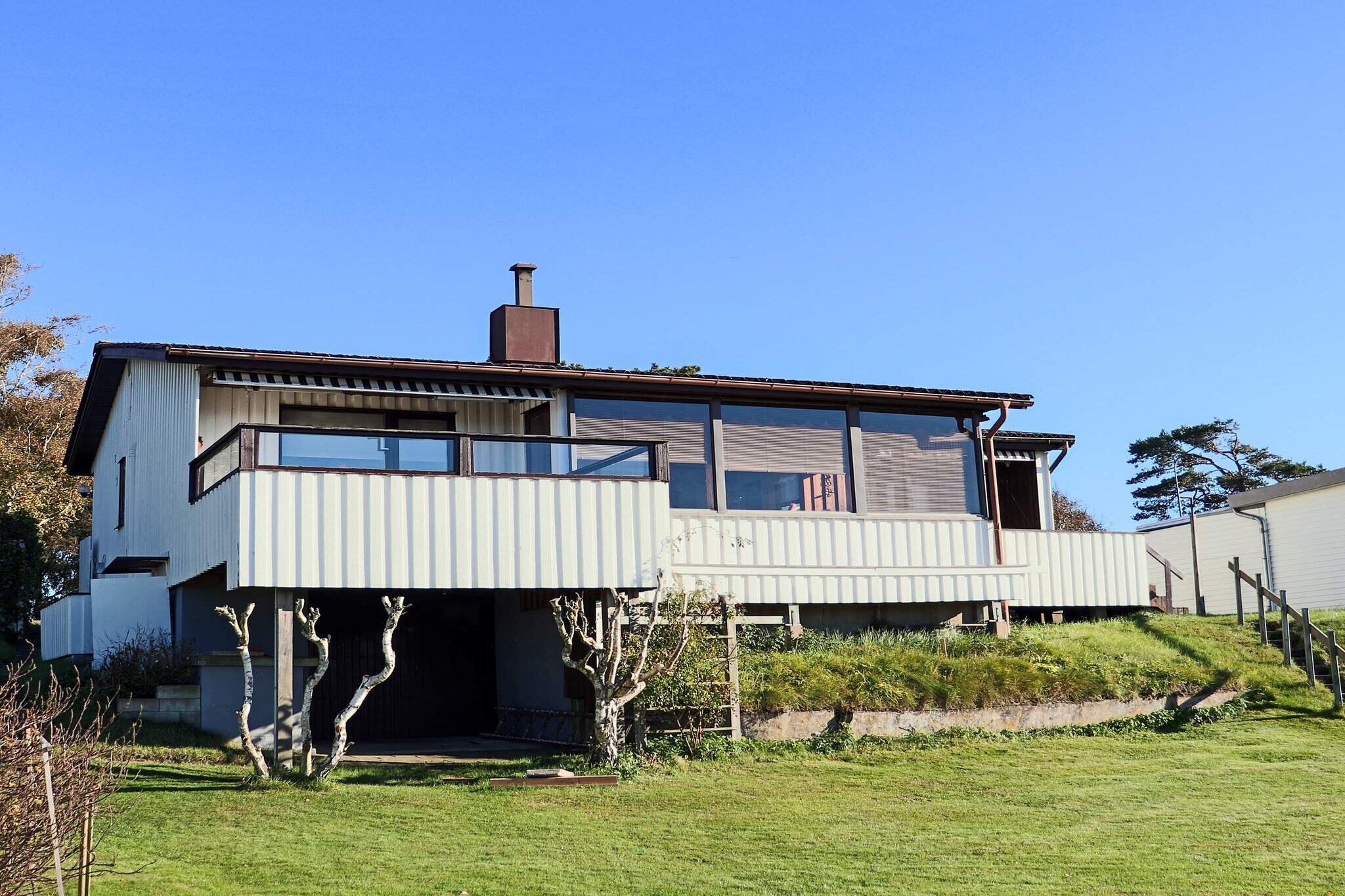 With an outstanding view of nature and the sea, this cottage is an idyllic retreat where you can experience the tranquility and beauty of coastal life. The house is located in the popular seaside resort of SkummeslÃ¶vstrand with a mile-long beach that awaits. Inside the cabin is a well-equipped kitchen with everything you need to cook simple meals or just enjoy a cup of coffee. In the living room, a TV with a wide range of channels awaits for the evening's entertainment. The three cozy bedrooms offer plenty of space for the whole family or friends, with two of them equipped with two single beds each and the third bedroom offering a comfortable double bed and a private bathroom with WC and wash basin. There is also a bathroom by the entrance with wc, wash basin and shower. Washing machine is in the basement for extra comfort. Outdoors, there are several options for those who love to be outside. Lovely lawn for playing and sunbathing. There is a balcony on the front and back of the house as well as a large, inviting conservatory at the front where you can spend time with friends and family well into the evening. SkummelÃ¶vstrand is a popular beach resort and for those who are tired of the sea, it is a walking distance to the beach about 1.5 km away. Here is a 25-metre heated seawater pool. By the pool there is also a kiosk with simple snacks. If you want to make a day trip, visit Svarvareskogen, a green oasis with a large number of hiking trails and two exercise loops. For those who like tennis, go to SkummeslÃ¶vs Tennisklubb, one of Sweden's largest tennis facilities. If you like adventure, you should go to Kungsbygget Adventure Park, they offer active experiences with summer tobogganing, zipline, climbing, cycling and bungy rocket. There is a lot to do and see here. The house is very well planned and well thought out and makes for a perfect holiday.