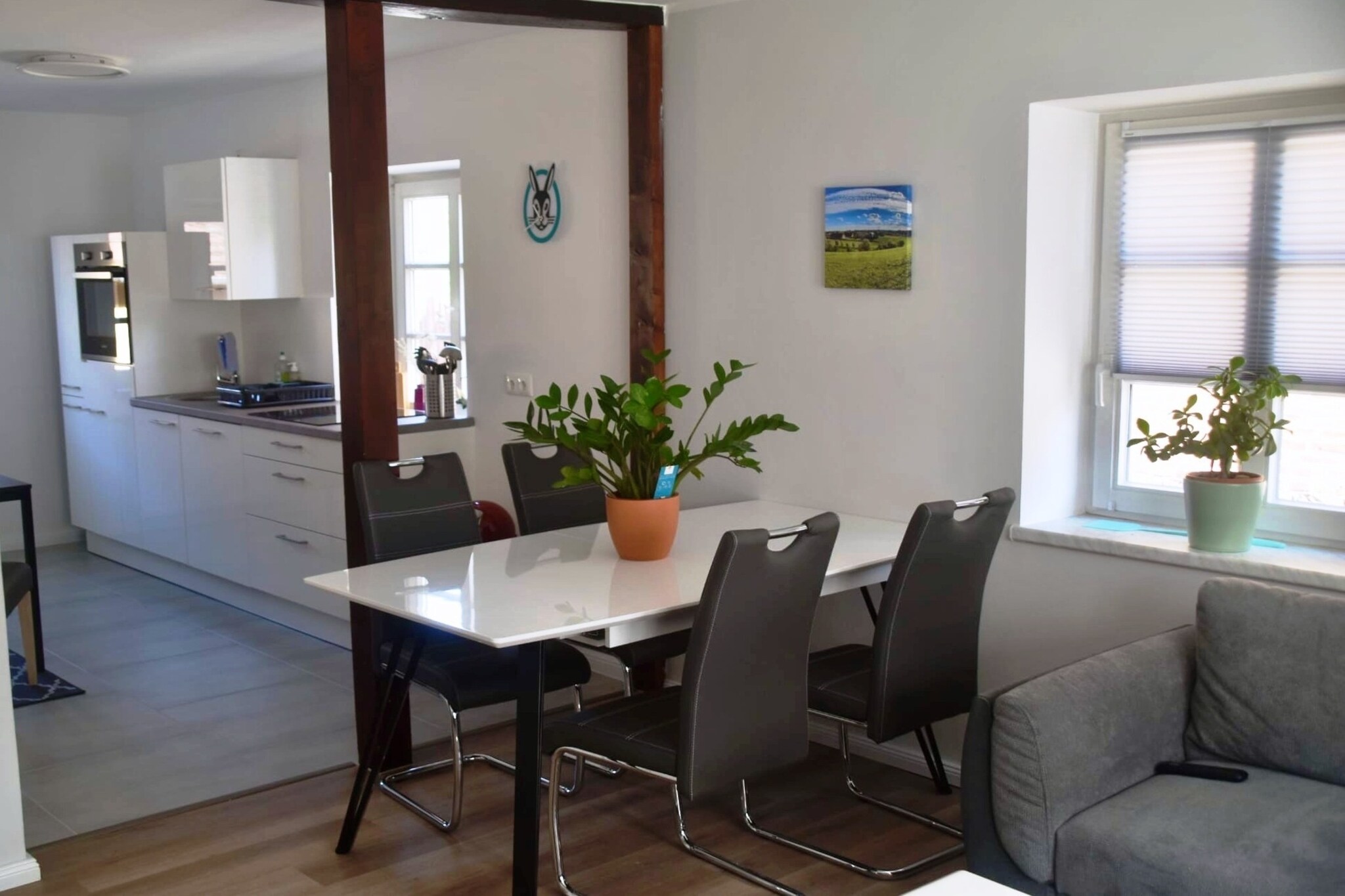 Ground floor: (Living room(TV(satellite), netflix), open kitchen(dining table(4 persons), seating area(2 persons), electric kettle, toaster, cooker(4 ring stoves, ceramic, electric), coffee machine, oven, dishwasher), bedroom(double bed(boxspring, 180 x 200 cm)), bedroom(single sofa bed(90 x 200 cm)), bathroom(shower(walk-in shower), washbasin, toilet, washing machine), Landing)\n\nseating area, grill, heating, courtyard, bicycle storage, parking, Towels incl., Laundry Package incl.