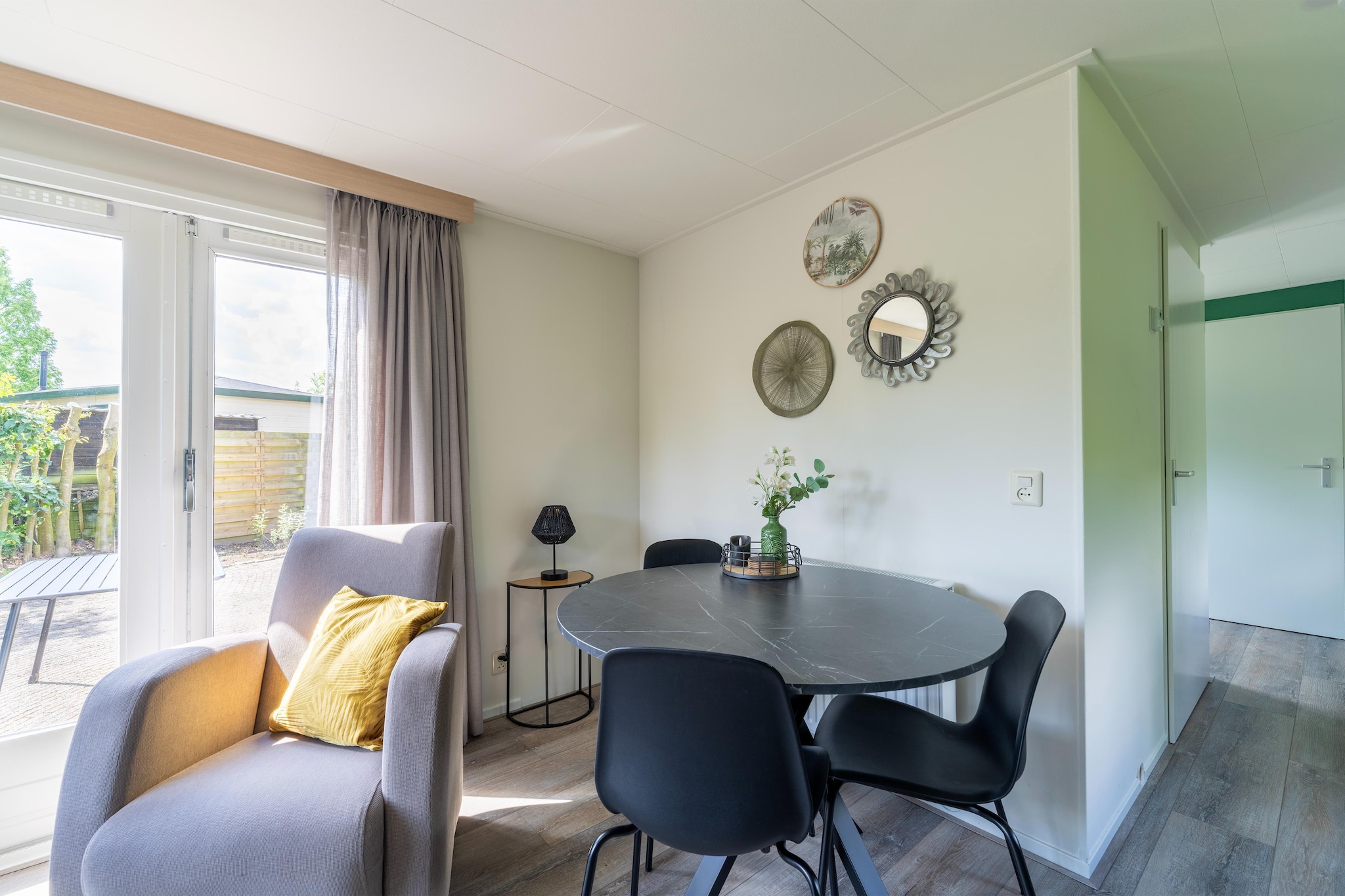 Ground floor: (Living room(TV, seating area(4 persons)), Kitchen(electric kettle, cooker, hood, oven, microwave, fridge-freezer), bedroom(double bed), bedroom(bunk bed), bathroom(shower, washbasin), toilet)\n\nair conditioning, garden furniture, parking, Garden shed