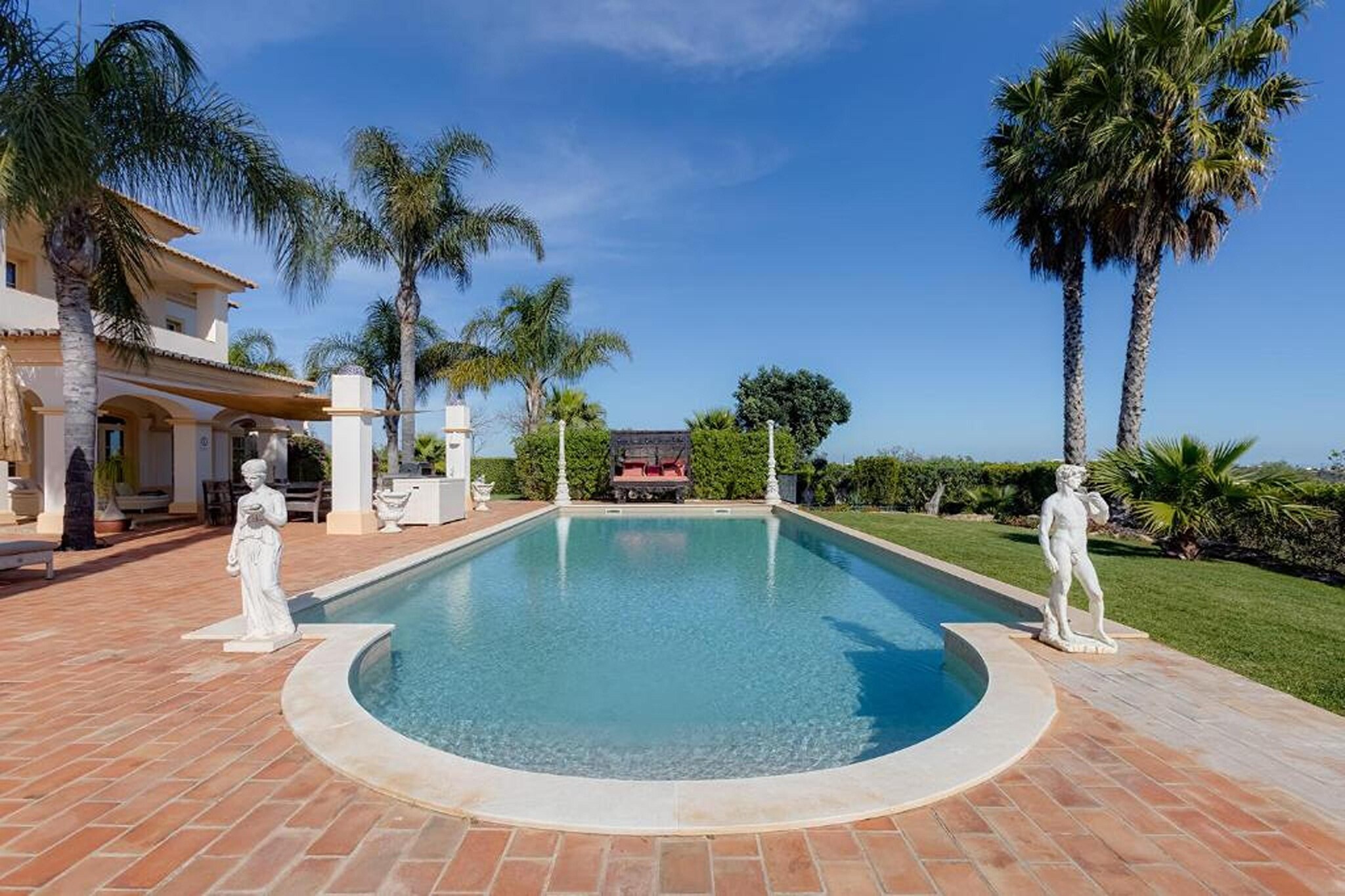 Welcome to your dream holiday retreat! Nestled in the serene and exclusive residential enclave of Lagos, this charming luxury villa offers an unparalleled blend of sophistication and comfort, promising an unforgettable getaway experience. For the ultimate in relaxation, immerse yourself in the bubbling waters of the hot tub or take a refreshing dip in the sparkling swimming pool, all while soaking in breathtaking views of the bay and surrounding landscape. 
There are lots of opportunities for activities and outings in and from Lagos. For instance: boat excursions to the beautiful grottos, Lagos Zoo, horseback riding, hiking in nature, Water parks with lots of big water slides, trips to surrounding towns, historical monuments and places of interest, shopping, biking, etc. 
Spanning across multiple levels, this spacious villa boasts four tastefully appointed bedrooms and four luxurious bathrooms, ensuring ample space and privacy for up to eight guests.  Entertainment and relaxation abound in the villa's three inviting living rooms, perfect for unwinding with loved ones or indulging in quiet contemplation. For culinary enthusiasts, two fully equipped kitchens await, where you can unleash your culinary creativity and savor delectable meals. Indulge your senses in the villa's lush interior garden, offering a serene oasis of greenery and tranquility. Lose yourself in a good book in the cozy library, or rejuvenate your body and mind in the well-appointed gym and sauna.