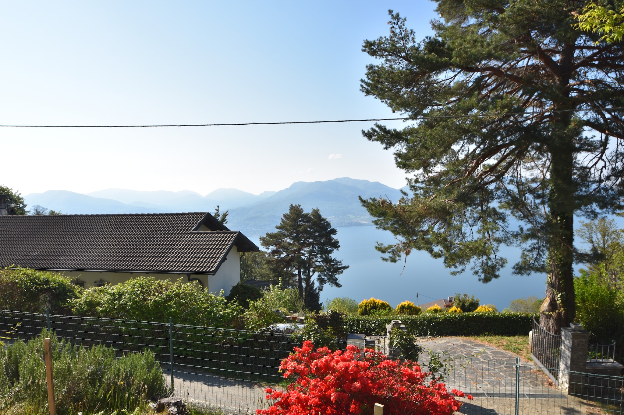 An optional utilities and service fee of EUR 250,00 will be charged before your arrival. Details are given below.<br> This romantic house on Monte Carza, near Lake Maggiore has a stunning beamed ceiling and antique furniture. The flat garden surrounded by greenery offers breathtaking views of the lake. Ideal for family holidays. In the region you will find excellent restaurants that can be reached both on foot and by car. Cannero is 7 km away and you can stroll through its pretty streets or laze on the beach. Hiking enthusiasts can visit the Val Grande National Park, with beautiful trails that are also suitable for children. In Trarego itself you will find a small supermarket for daily shopping. The accommodation has a long balcony where you can start your days relaxed with a cup of coffee or tea. The children can play carefree in the large garden and you can park your car right in front of the house. Especially in summer, you will fall asleep like a log by the soothing atmosphere of the Alps. <br><b> Optional Utilities & Service Package </b><br><b> An optional utilities and service package of EUR 250,00 </b> can be selected prior to your arrival. You will receive a separate communication with the payment link should you wish to include it.<br>This package ensures a seamless stay and conveniently covers services such as final cleaning, utility consumption, service support, and protection against minor damages or incidental costs during your stay.<br>Guests who prefer may manage these services independently, provided the property is returned in good order at check-out.