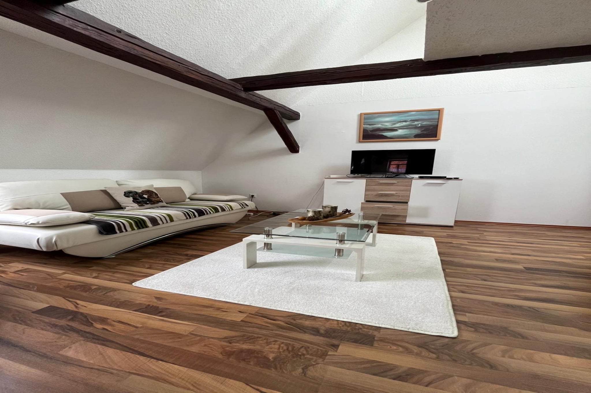 This cozy second-floor apartment in Elbingerode offers a peaceful escape with free WiFi, ideal for couples or small families. Located near the Harz Mountains, it’s a perfect base to explore local gems like the Königshütter Waterfall, the historic Erzgrube Büchenberg mine, and the panoramic Kaiserturm lookout. Nature lovers will enjoy hiking Galgenberg or relaxing by the nearby Naturbad Elbingerode lake.
The apartment features a bright living room with a single sofa bed, TV, and seating area. The open kitchen is equipped with a coffee machine, oven, dishwasher, and kettle—perfect for home-cooked meals. A comfortable double bedroom and a spacious bathroom with both bathtub and shower ensure a relaxing stay. Additional amenities include a washing machine, private terrace, garden furniture, barbecue, and on-site parking.
Surrounded by forest trails and scenic lakes, the location is ideal for year-round adventure. Dining options nearby include the rustic Waldbad-Schenke, the hearty Restaurant Bodetal, and the welcoming Zum Alten Forsthaus Todtenrode.