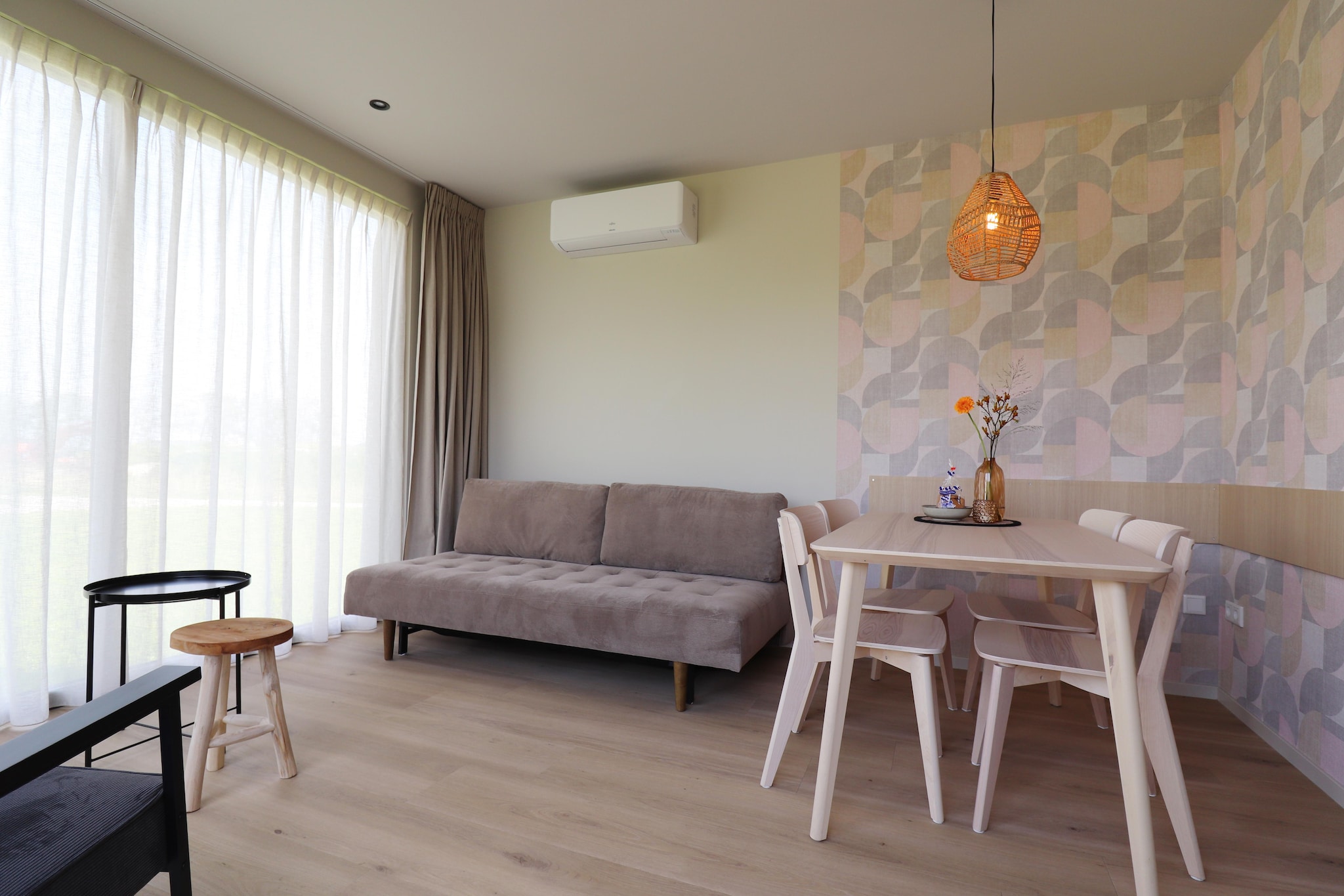 These modern holiday homes are located in Menaam, an authentic Frisian town. Behind a characteristic farm you will find
"recreation in the garden", with beautifully landscaped camper pitches and these two beautiful holiday homes. You look out over the beautiful Frisian landscape. These houses are located next to each other and are very suitable for 2 families traveling together.

The cottages can accommodate 5 guests each. There are 2 bedrooms per house, 1 with a double bed and 1 with a bunk bed. There is a comfortable sofa bed in the living room. The houses are tastefully decorated and have a luxurious kitchen and bathroom. Air conditioning provides coolness in summer and warmth in winter.

From the houses you can immediately follow beautiful walking and cycling routes in the surrounding area, but a visit to the Eleven Cities towns such as Franeker and Harlingen are also very worthwhile.

In the evening you can relax on the terrace while enjoying a snack and a drink. You can rent these houses separately via Belvilla house codes NL-9036-10 and NL-9036-11.