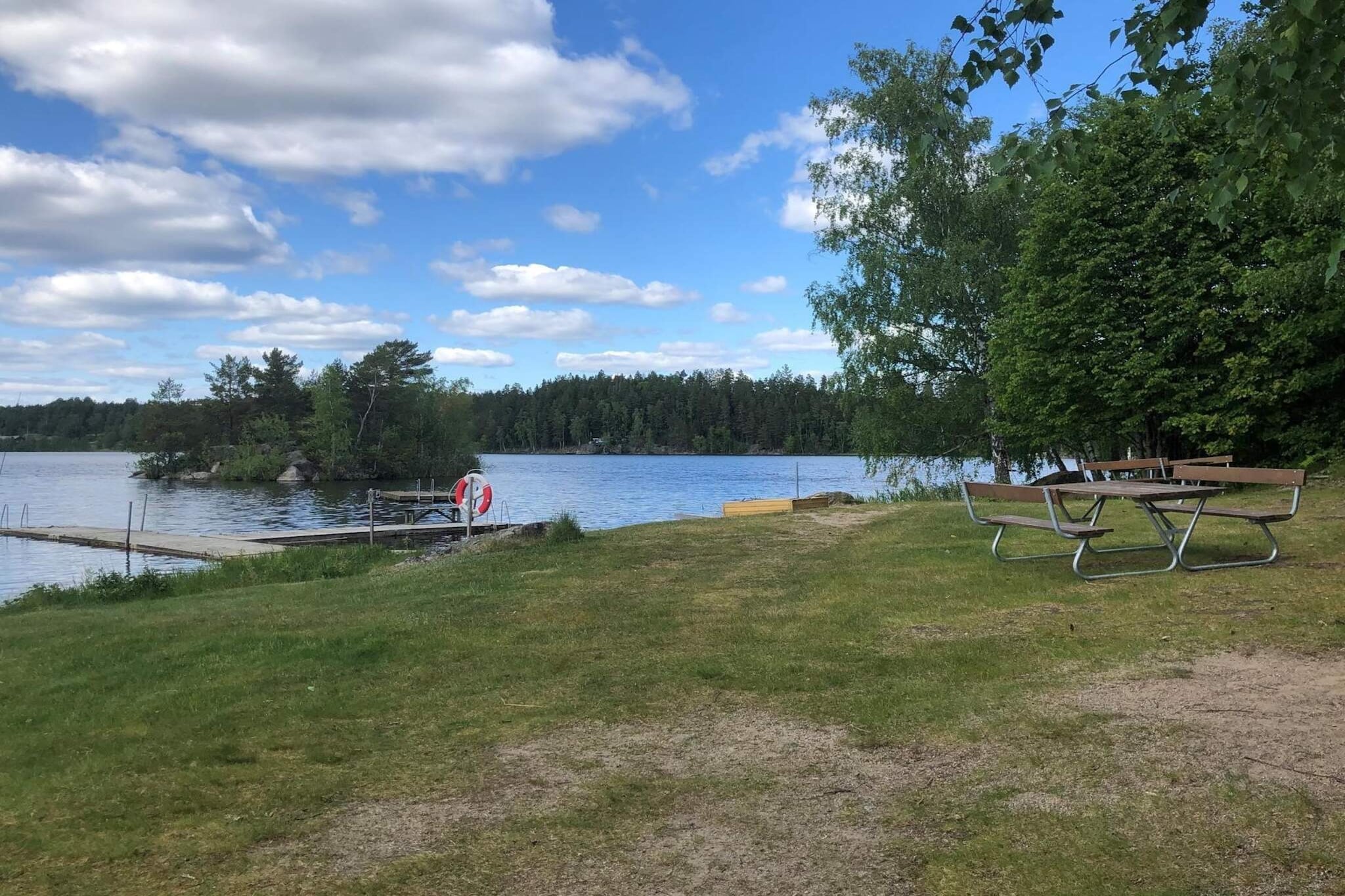 This charming and beautiful cottage, built in a traditional style, is in the pleasant and tranquil area of MalmsjÃ¶berg, where you have walking distance to a cozy bathing spot at Lake Nedingen. Indoors, the walls and ceilings are clad in wood, giving a very solid impression, and the cottage is tastefully decorated with high ceilings. You have an open plan layout with a living room and kitchen with a nice dining area indoors. There are two bedrooms, one with a double bed and the other with a bunk bed. In the loft, there are two additional good sleeping spaces. The bathroom is completely renovated and has a shower, toilet, and sink. On the terrace, there is both a glazed section with a cozy seating area and a dining table. If you want to enhance the outdoor feeling, you can open the doors that enclose the terrace with glass. If you want to sunbathe by the cottage, it is also excellent on the terrace as it is spacious with plenty of room even without a roof. Next to the terrace, you have the cottage's barbecue area where there are good grills available; remember to buy charcoal for the grill. When in the area, you certainly want to take the opportunity to swim in Nedingen, which is easily done by taking a short walk, so there is nothing stopping you from taking both a morning and an evening dip. You have a lot to discover in the region around MalmsjÃ¶berg. There are several hiking trails and natural areas with marked trails, and if you want to visit MalmkÃ¶ping, there are charming narrow streets in the old part of MalmkÃ¶ping where there are markets and lively atmosphere on some days during the summer. Welcome to SÃ¶rmland and MalmsjÃ¶berg