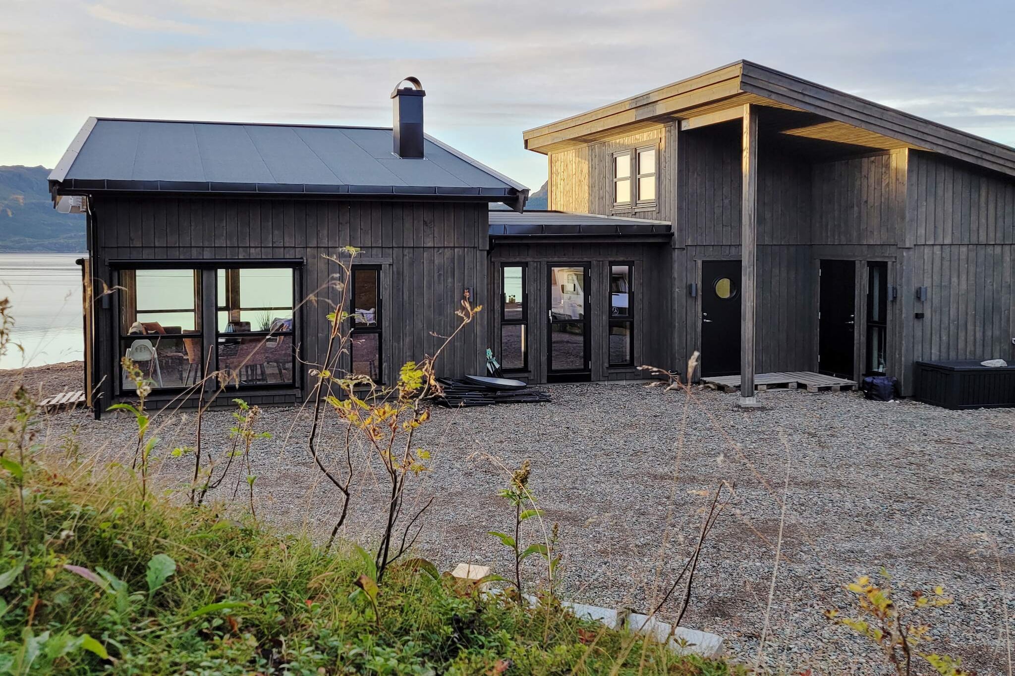 Comfortable and modern holiday house by Eidsfjorden. From the cabin and sauna, there are a magnificent view of the beautiful fjord landscape with the sunset and the midnight sun.  Great starting point for day trips around Vesterålen and Lofoten by car. The cabin is tastefully furnished with light wood in the walls and ceiling. The living room and kitchen have large windows facing the fjord, which make the rooms bright and pleasant. Above the sofa group in the living room there is a mezzanine with 2 chairs and a table. From here there is a fantastic view of the fjord, the sunset, and the midnight sun. 2 bedrooms, one with a double bed and one with a family bunk with an extra-wide bunk bed downstairs and a single upstairs. Above the bedrooms is a loft with a double sofa bed and 2 mattresses. In the living room there is a TV with Norwegian and international channels and a wood-burning stove that provides pleasant warmth even on cold autumn and winter days. Free internet. The plot is sunny and child friendly. From the terrace and the cabin there is a magnificent view of the fjord and the beautiful mountain landscape. The mountain Reka with its distinctive rock formation can be seen on the other side of the fjord to the north. Sauna for 6 people is in a separate building next to the cabin. Here you can sit and enjoy the view of the fjord and the sunset through the large windows. On fine evenings with the midnight sun casting its red rays over the landscape, this is an experience you are unlikely to forget. On the terrace there is outdoor furniture and a barbecue. The landscape around the fjord invites you to wonderful walks and from the mountaintops there is a great view. In the fjord there is good sea fishing and fishing can be done with a pole. Nice starting point for day trips by car around Vesterålen, to the small fishing villages on the west side of Langøya. On the west side of Andøya is a beautiful coastal landscape with idyllic sandy beaches and dramatic mountain scenery, shaped by the ocean over millennia. At Andenes, whale watching is by boat out to sea. Seeing the big whales up close is an exciting experience for the whole family. Day trips can also be made by car to Lofoten in the south with a car ferry from Melbu to Fiskebøl. 25 km to the coastal towns of Sortland and Stokmarknes with shops and restaurants. Parking space on the plot.