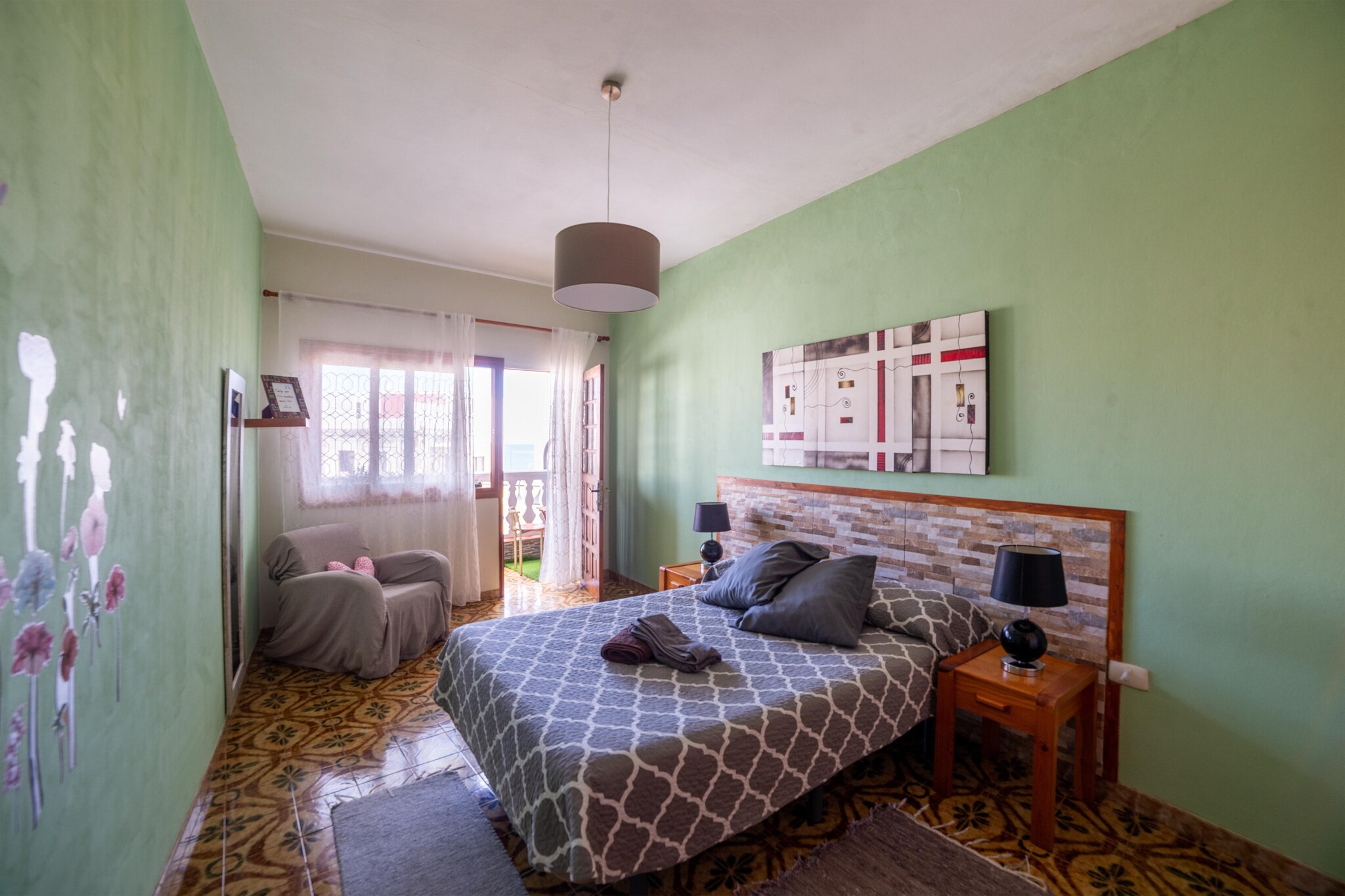 Ground floor: (Entrance(reachable from the outside), open kitchen(hob, electric kettle, hood, coffee machine, oven, microwave, fridge-freezer), Living/diningroom(TV(flatscreen), dining table, seating area), bathroom(bathtub with shower, washbasin, toilet))\n\nOn the 1st floor: (bedroom(double bed, balcony or terrace), bedroom(bunk bed or 2 single beds))\n\nAttic: (seating area(4 persons), roof terrace, BBQ)\n\nwashing machine, terrace(private), iron