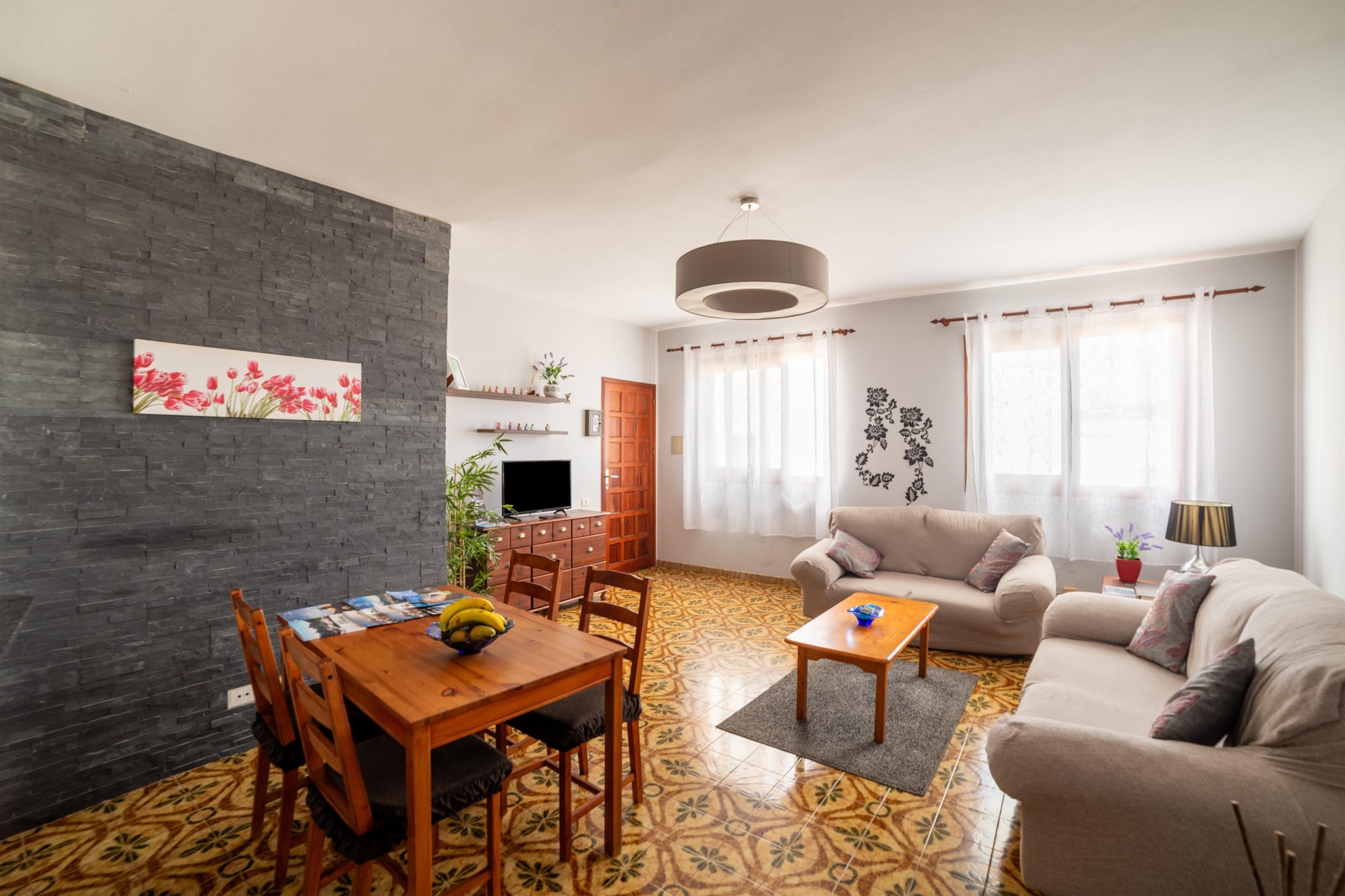 Spend a wonderful time in this retro-style holiday home carefully renovated and decorated in Los Silos. There is a comfortable private terrace to enjoy the breeze and the great views. This place is an ideal vacation stay for families or a group of friends.  

The holiday home is just 3-minute walk from Playa de La Caleta, 700 m from Playa de El Bajío and less than 1 km from Playa Gomeros. You can spend as much time as you want discovering the area by fishing and diving in the surroundings. Los Gigantes is 35 km from the accommodation, and Aqualand is 49 km away 

In addition, this house offers direct access to a large roof terrace and has 2 double bedrooms, a bathroom with a bathtub and a fully equipped and semi-open kitchen. There is a flat-screen TV and a lounge with sofas. In short, you will never have a dull moment here!  

The closest airport (Tenerife North Airport – City of La Laguna).