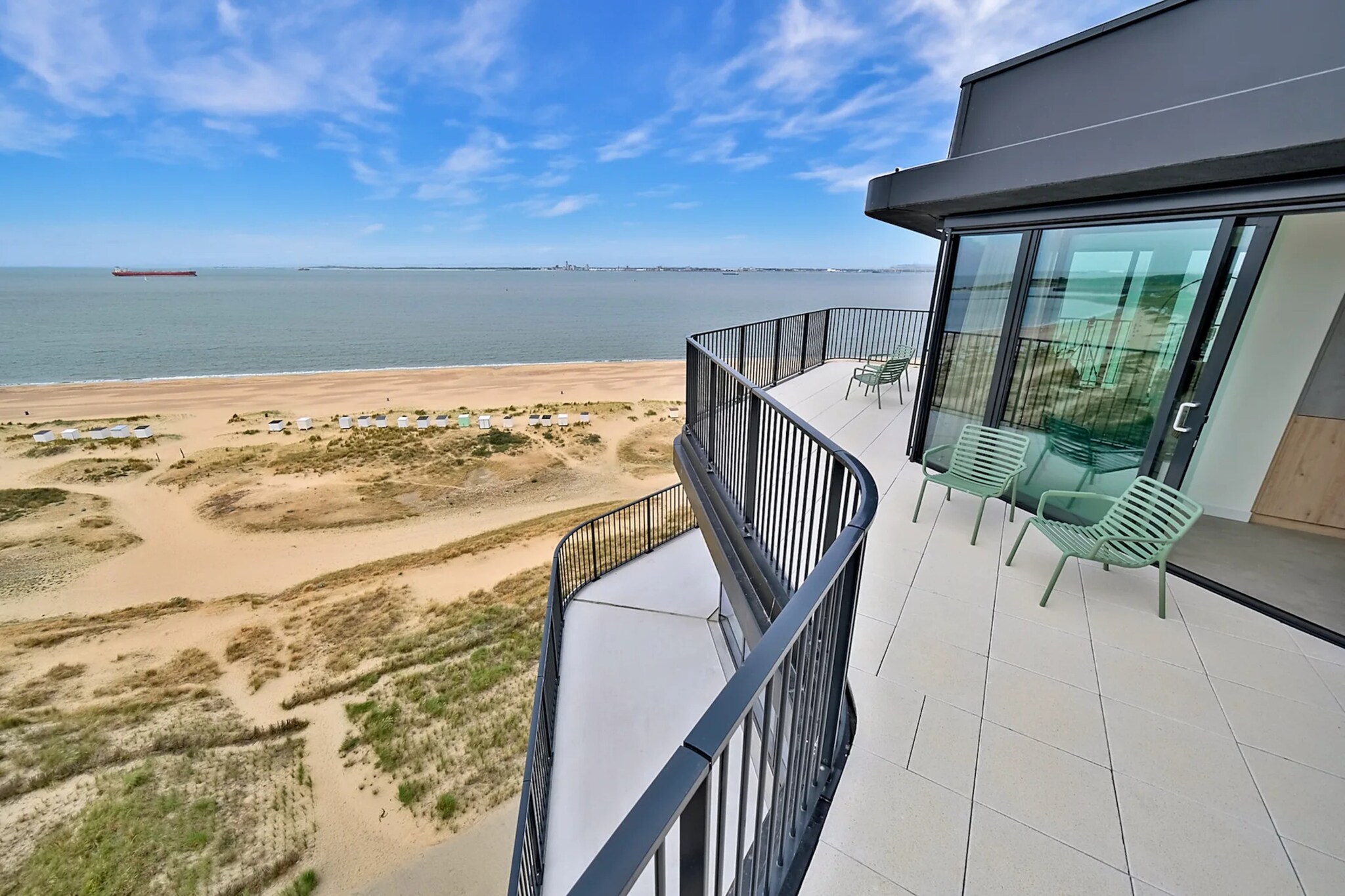 On the 11th floor: (Living room(TV(smart TV), dining table, fireplace, seating area), open kitchen(hob, coffee machine(espresso), oven, dishwasher, fridge-freezer, dishes and cutlery), bedroom(double bed), bedroom(double bed), Bedroom with bathroom(double bed, shower, washbasin, toilet), bathroom(shower, washbasin), toilet(toilet))\n\nsauna, washing machine, balcony, bicycle storage, garden furniture, parking, lift, Charging post for electric cars