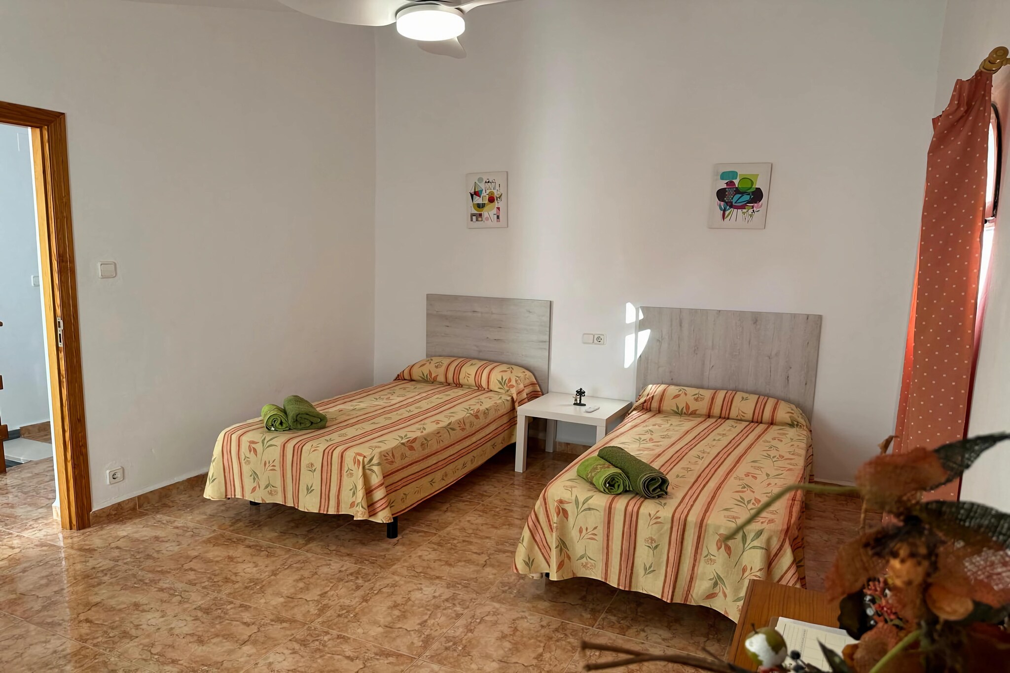 Living room(TV, seating area, air conditioning), dining room(dining table, seating area), Kitchen(toaster, cooker, coffee machine, oven, fridge-freezer, washing machine), bedroom(double bed), bedroom(single bed, single bed), bedroom(single bed, single bed), bedroom(double bed), bathroom(bathtub or shower, washbasin, toilet, bidet, hairdryer), bathroom(bathtub or shower, washbasin, toilet, bidet, hairdryer)