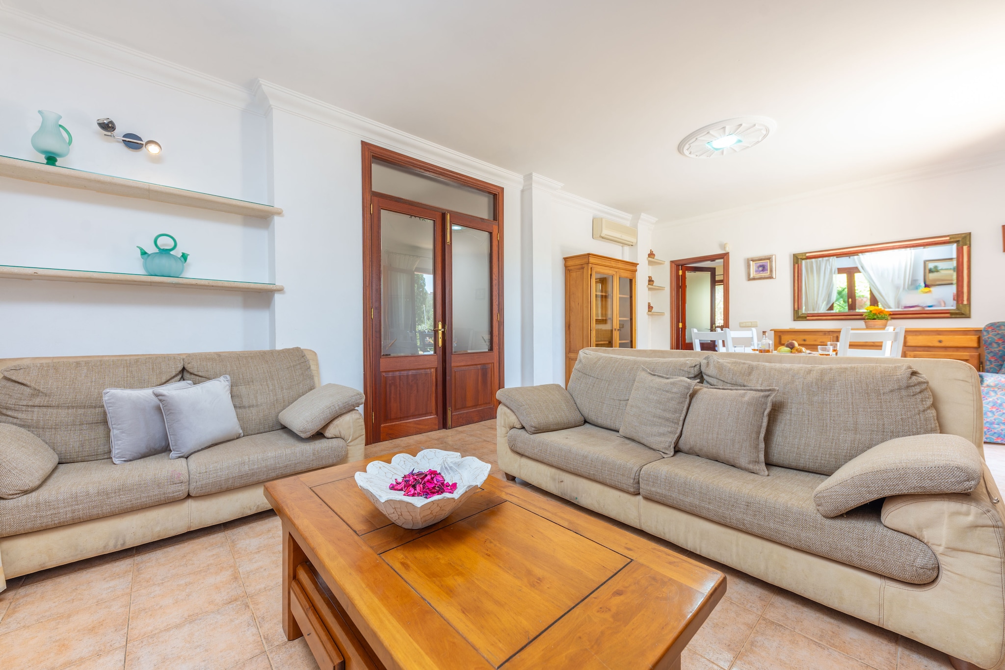 The exterior of the flat is designed to maximise the enjoyment of the Mediterranean climate. The property has an outdoor chlorine pool measuring 7.5 metres long by 3.5 metres wide, with a uniform depth of 1.70 metres, ideal for cooling off on hot days. Next to the pool, guests will find sun loungers for relaxing in the Mallorcan sun. The terrace also has a barbecue area under a porch that shades the table set up to enjoy outdoor meals with your companions.

The rustic interior, distributed over two floors, starts with an air-conditioned living room with Smart TV, which is open to the dining room, creating a large and bright space to relax and eat with your companions. In addition, the kitchen, equipped with ceramic hob, has all the necessary utensils to cook delicious dishes during your stay. There is a second very luminous room where you will find an armchair perfect to enjoy an afternoon reading a book. To finish this ground floor, you have a bedroom with two single beds, wardrobe and A/C, and a complete bathroom with bathtub. Going upstairs, you will find the two remaining bedrooms, both with a double bed and with access to the outside, one bedroom opens onto a balcony and the other onto a terrace with two hammocks, ideal for sunbathing. All the bedrooms of the house have wardrobe and A/C. Finally, a second complete bathroom with bathtub gives service to this first floor. There is a washing machine, dryer, iron and ironing board for your use during your stay. If you are travelling with a baby you can make use of the cot and high chair. 

Maria de la Salut, a charming village in the heart of Mallorca. With its peaceful and picturesque atmosphere, this destination offers an authentic Mallorcan experience. Stroll through its cobbled streets, admire its church and enjoy the hospitality of its inhabitants. There are a variety of bars and restaurants to enjoy the rich local gastronomy. Discover the rural beauty of the surrounding countryside, its fields and vineyards. The beach of Can Picafort and the beach of Muro are at a distance of approximately 15 km, perfect to enjoy a day at the sea. Consult the advertiser for possible charges. Pets are not allowed. The holding of events is forbidden. 
Distances
Beach: 15.2 km - Platja de Muro
Airport: 40.4 km - Palma de Mallorca
Golf course: 28 km - Club de Golf Alcanada
Town: 0.280 km - Maria de la Salut
Train station: 6.5 km - Sineu
Bus stop: 0.160 km - Maria de la Salut
Ferry: 51.2 km - Palma de Mallorca
Hospital: 0.450 km - Unitat BÃ sica de Maria de la Salut
Tourist license: ETV/7161There's a mandatory tourist tax in Balearic Islands, called Ecotasa. All guests, except people under 16 years, have to pay this tax. The amount varies between 0.55â‚¬/night and guest during the low season and 2.2â‚¬/night and guest during  the high season .The tax is reduced by half from the 9th day for your stay.