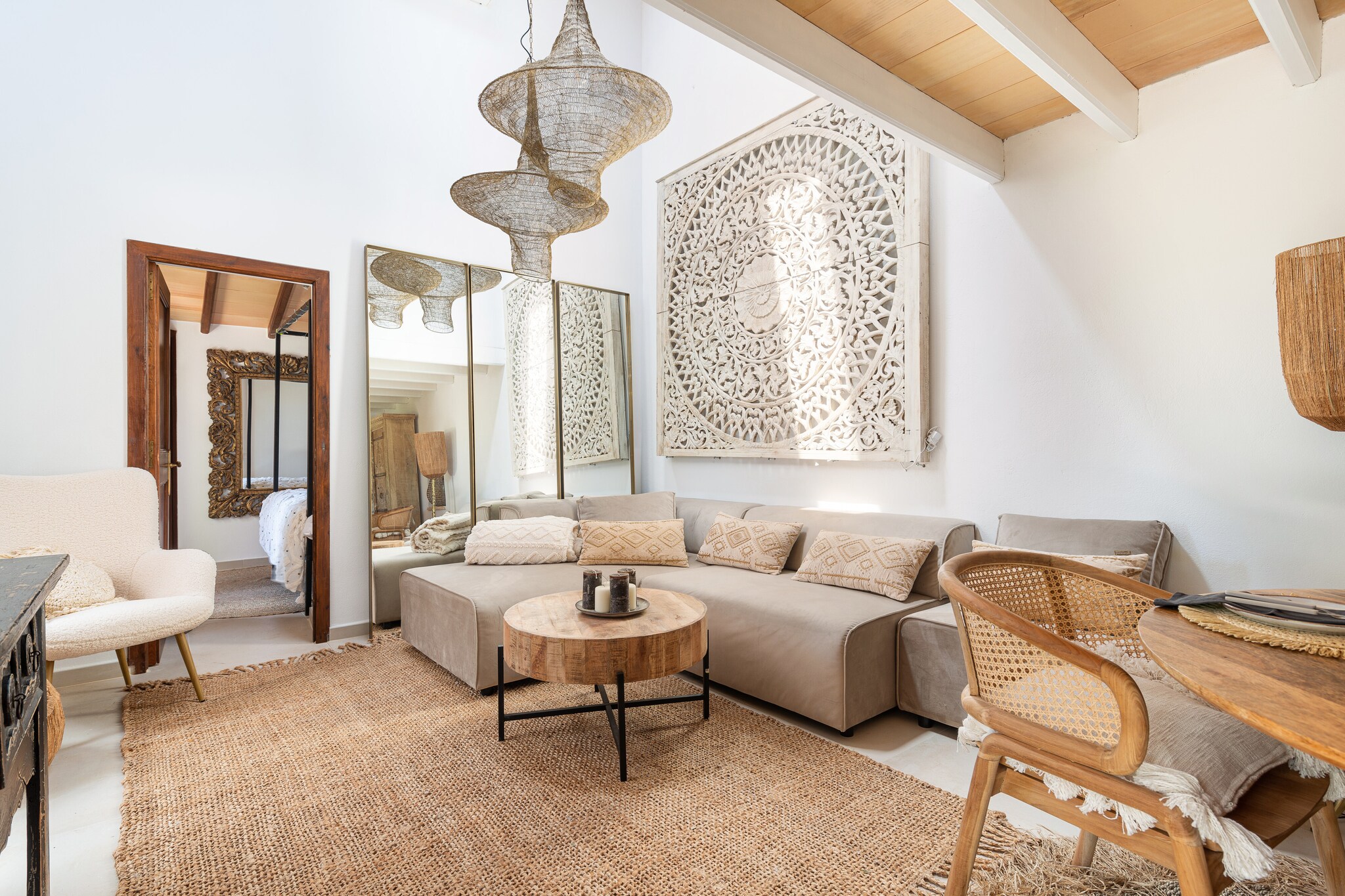 The beautiful exteriors of this country house with a boho feel offer an idyllic space thanks to its extensive garden in which the swimming pool is located, perfect for relaxing and enjoying the Mediterranean climate. The salt pool measures 10 x 6 metres wide, with a depth that varies from 0.10 to 1.80 metres, thus simulating a beach shore. In addition, there is a jacuzzi next to the pool that invites you to relax in it. Around the pool there is a Balinese bed and two sun loungers with a thatched umbrella where you can sunbathe after a swim. The garden also has a porch where we can find a bed where we can take a nap in the open air under the shade of this porch. Before entering the house, there is another fully furnished porch where you can enjoy the barbecue next to it. 

Entering the modern house distributed over two floors, you will first find a living-dining room. The living area has a huge sofa that invites you to relax while watching a movie on the TV with Smart TV. Next to it, you will find a table with 4 chairs where you can enjoy the meals prepared in the ceramic hob kitchen fully equipped with the necessary utensils for your day to day life during your stay. On this floor you will find the first bedroom of the property, which has a double bed, wardrobe and an en-suite bathroom with shower. To complete the ground floor, you will find a second complete bathroom with shower. With the stairs that you will find in the living room, you will access the first floor where you will find the second bedroom which, like the first one, has a double bed and a wardrobe. To make your stay more comfortable, the house has an A/C in the bedroom on the ground floor and an A/C at the top of the living room which provides fresh air to both the living room and the bedroom on the first floor. If you are travelling with babies, a cot and high chair are available. 

The villa is located in the area of Binissalem, which is in the centre of Mallorca so it is very easy to get anywhere in a reasonable time. The charming village, known for its wine culture and historical wine cellars, is only 5 km away. There you will find everything you need; bank, petrol station, supermarket, doctor, pharmacies, and, above all, bars and restaurants where you can enjoy the varied Mallorcan gastronomy. Furthermore, the village has a train station that connects with the city of Palma de Mallorca. If you prefer to enjoy the coast, you can opt for the extensive Alcudia Beach, known for its crystal clear waters and golden sand.

Please note that a cat lives on the property and is often in the vicinity. Consult the advertiser for possible charges. Pets are welcome. The holding of events is forbidden. There is exterior parking for 4 cars.  
Distances
Beach: 29.7 km - Platja d'Alcudia
Airport: 30 km - Palma de Mallorca
Golf course: 26.5 km - Golf de Son Termes
Town: 5.2 km - Binissalem
Train station: 5.6 km - Binissalem
Bus stop: 6.9 km - Inca
Ferry: 33.4 km - Alcudia
Hospital: 5 km - PAC Binissalem
Tourist license: ETV/3861Single Rental Registry: ESFCTU000007022000124923000000000000000000000ET/38610There's a mandatory tourist tax in Balearic Islands, called Ecotasa. All guests, except people under 16 years, have to pay this tax. The amount varies between 0.55â‚¬/night and guest during the low season and 2.2â‚¬/night and guest during  the high season .The tax is reduced by half from the 9th day for your stay.