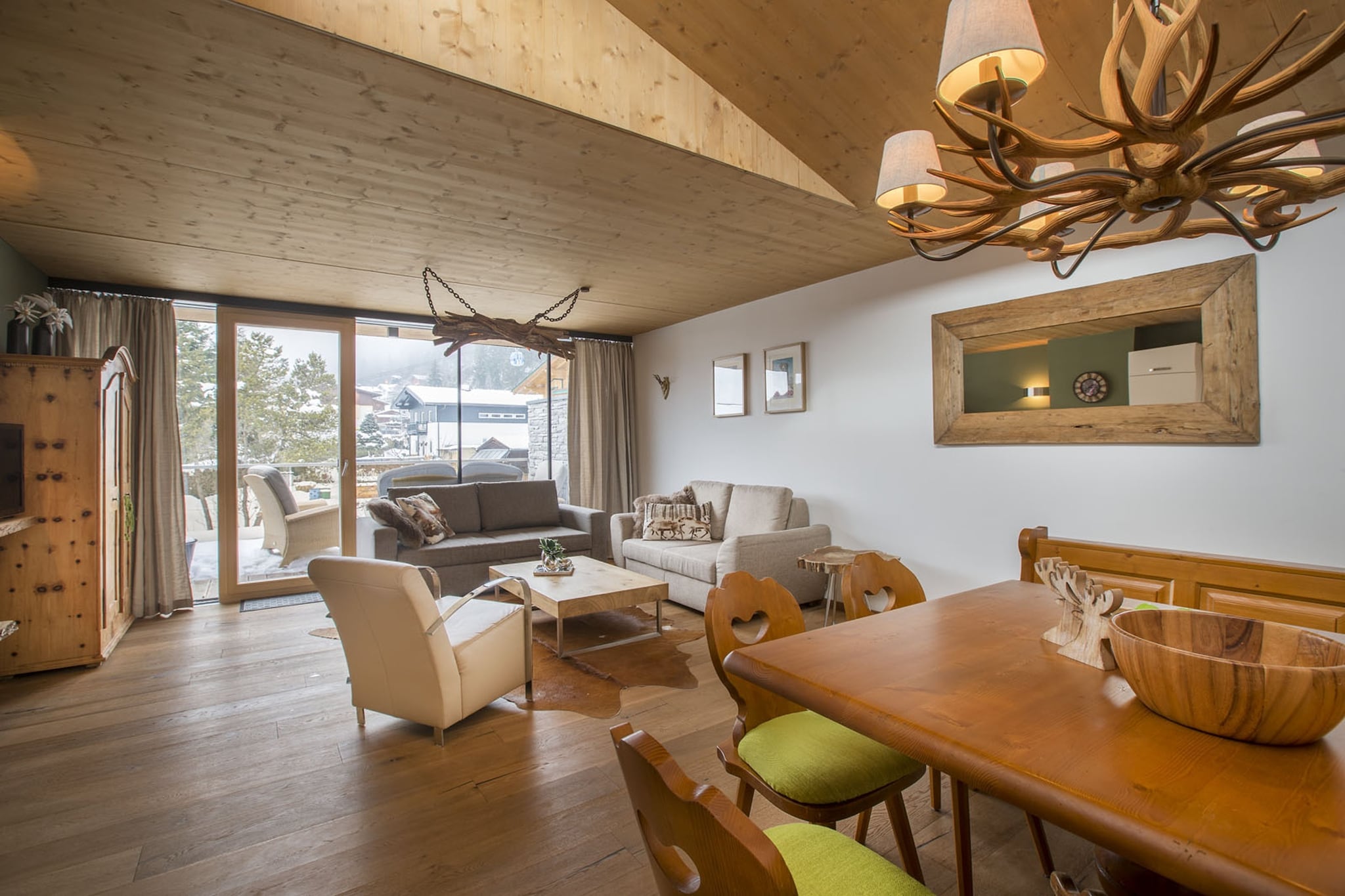 On the 1st floor: (Living room(double sofa bed), open kitchen(cooker(ceramic), oven, dishwasher, fridge-freezer), bedroom(double bed), bedroom(double bed, TV), Bedroom with bathroom(double bed, shower, washbasin, toilet), bathroom(shower, washbasin, toilet))\n\nsanitary facility(tumble dryer(shared with other guests), washing machine(shared with other guests)), relaxation area(shared with other guests)(shower, massage shower, sauna, toilet), garage, ski boot heaters, balcony or terrace, heating(Floor heating), lift, safety deposit box